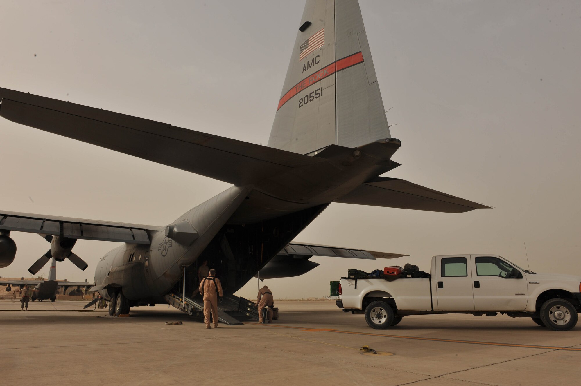 Aeromedical crew members put their gear on a C-130 Hercules before an aeromedical evacuation mission at Joint Base Balad, Iraq, May 13, 2010.  The members are deployed to the 332nd Expeditionary Aeromedical Evacuation Flight, Joint Base Balad, Iraq.  (U.S. Air Force photo/Staff Sgt. Quinton Russ/released)
