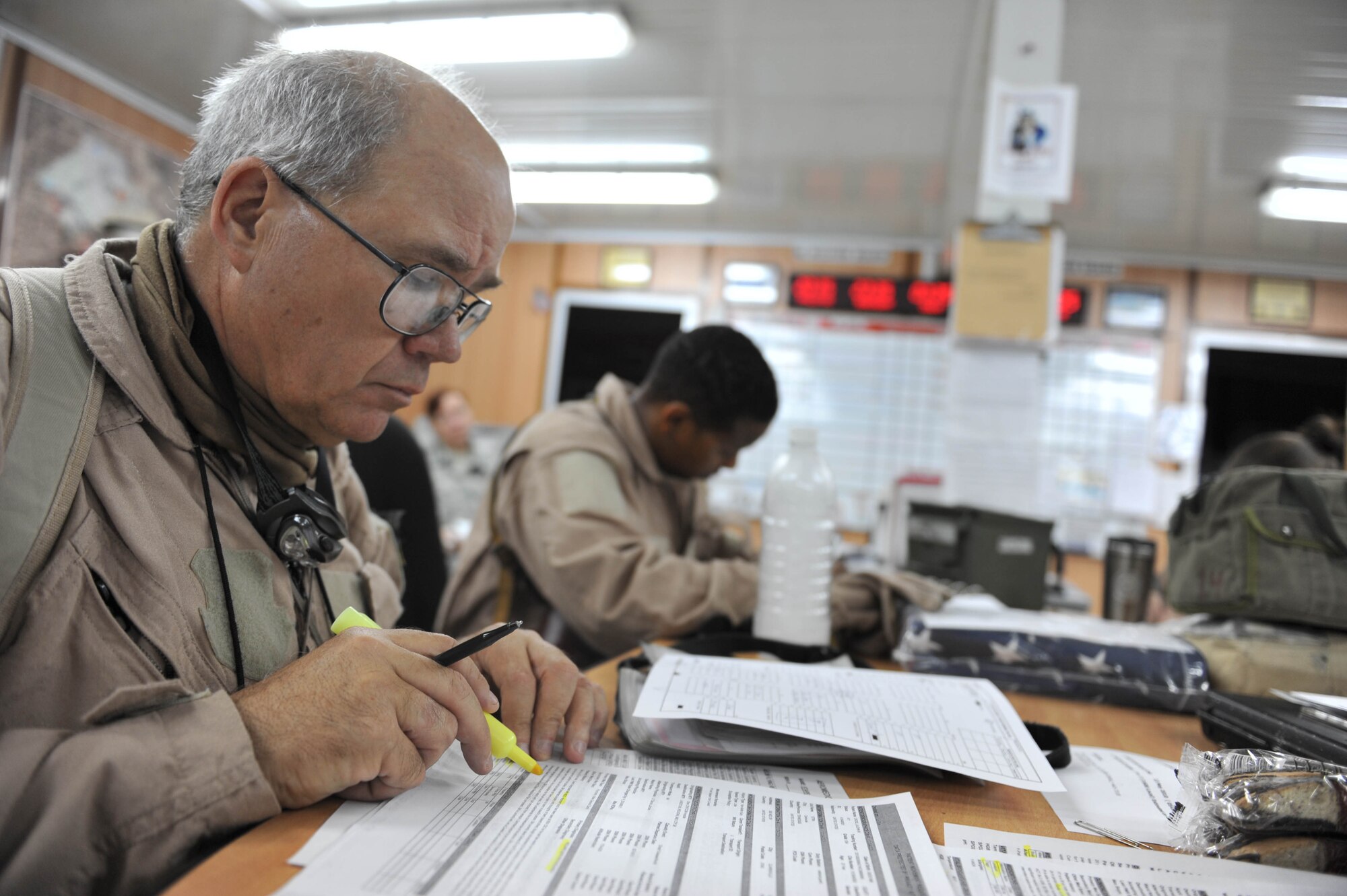 U.S. Air Force flight nurse, Lt. Col. Jeffery Starr, takes notes during a crew briefing before an aeromedical evacuation flight at Joint Base Balad, Iraq, May 13, 2010.  Colonel Starr is deployed to the 332nd Expeditionary Aeromedical Evacuation Flight, Joint Base Balad, Iraq.  (U.S. Air Force photo/Staff Sgt. Quinton Russ/released)