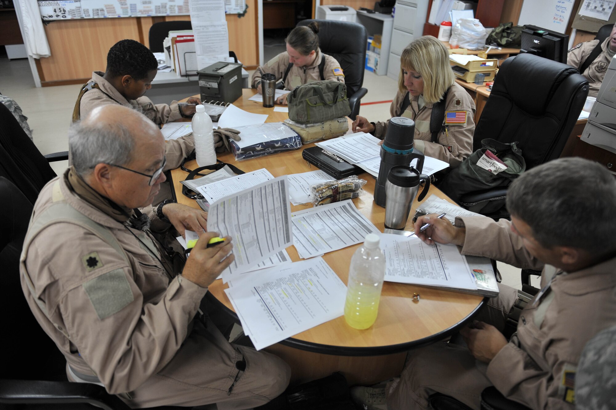 Aeromedical crew members brief before flying a mission at Joint Base Balad, Iraq, May 13, 2010.  The members are deployed to the 332nd Expeditionary Aeromedical Evacuation Flight, Joint Base Balad, Iraq.  (U.S. Air Force photo/Staff Sgt. Quinton Russ/released)