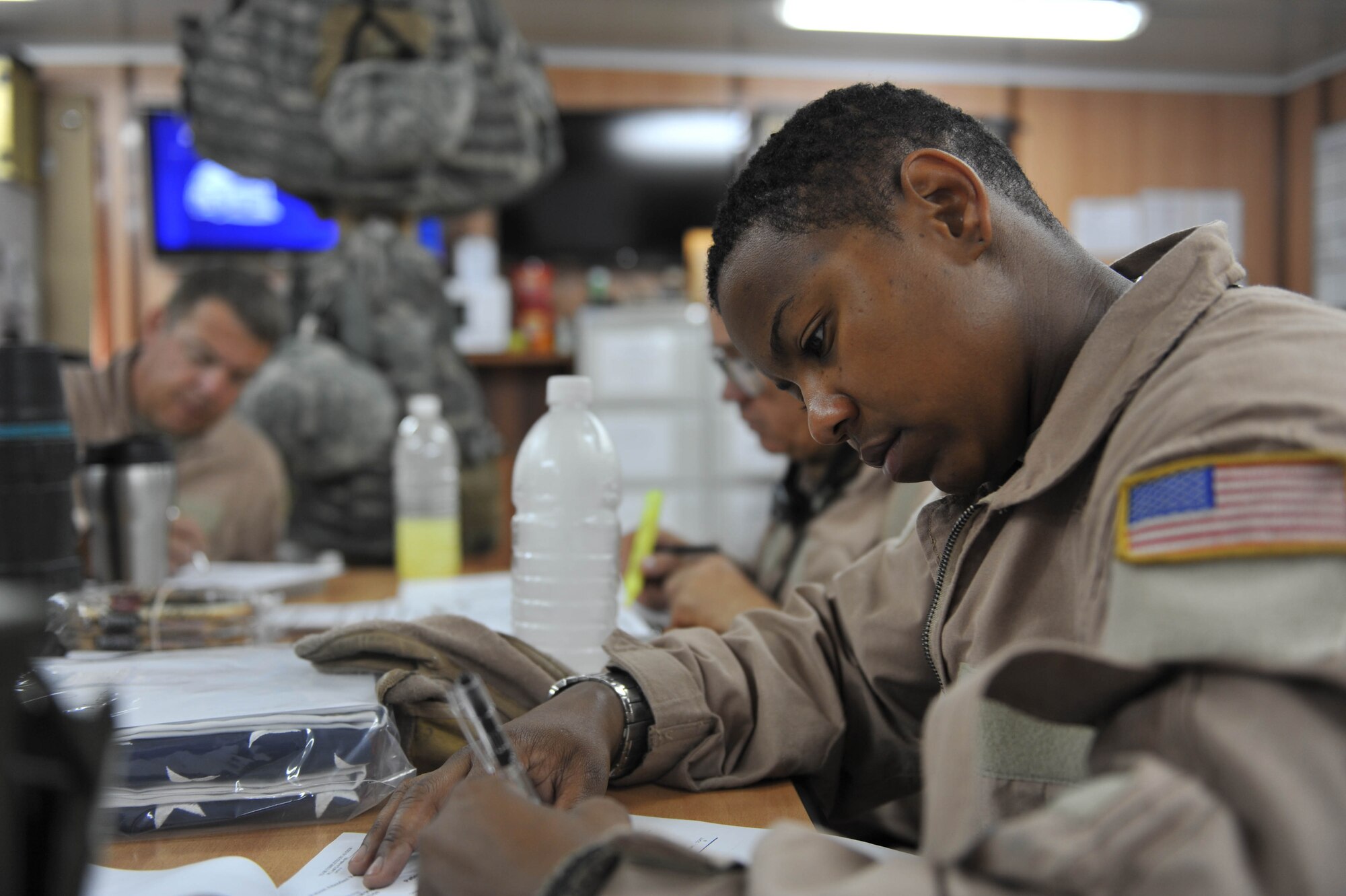 U.S. Air Force medical technician, Tech. Sgt. Melinda Ford, takes notes during a crew briefing before an aeromedical evacuation flight at Joint Base Balad, Iraq, May 13, 2010.  Sergeant Ford is deployed to the 332nd Expeditionary Aeromedical Evacuation Flight, Joint Base Balad, Iraq.  (U.S. Air Force photo/Staff Sgt. Quinton Russ/released)