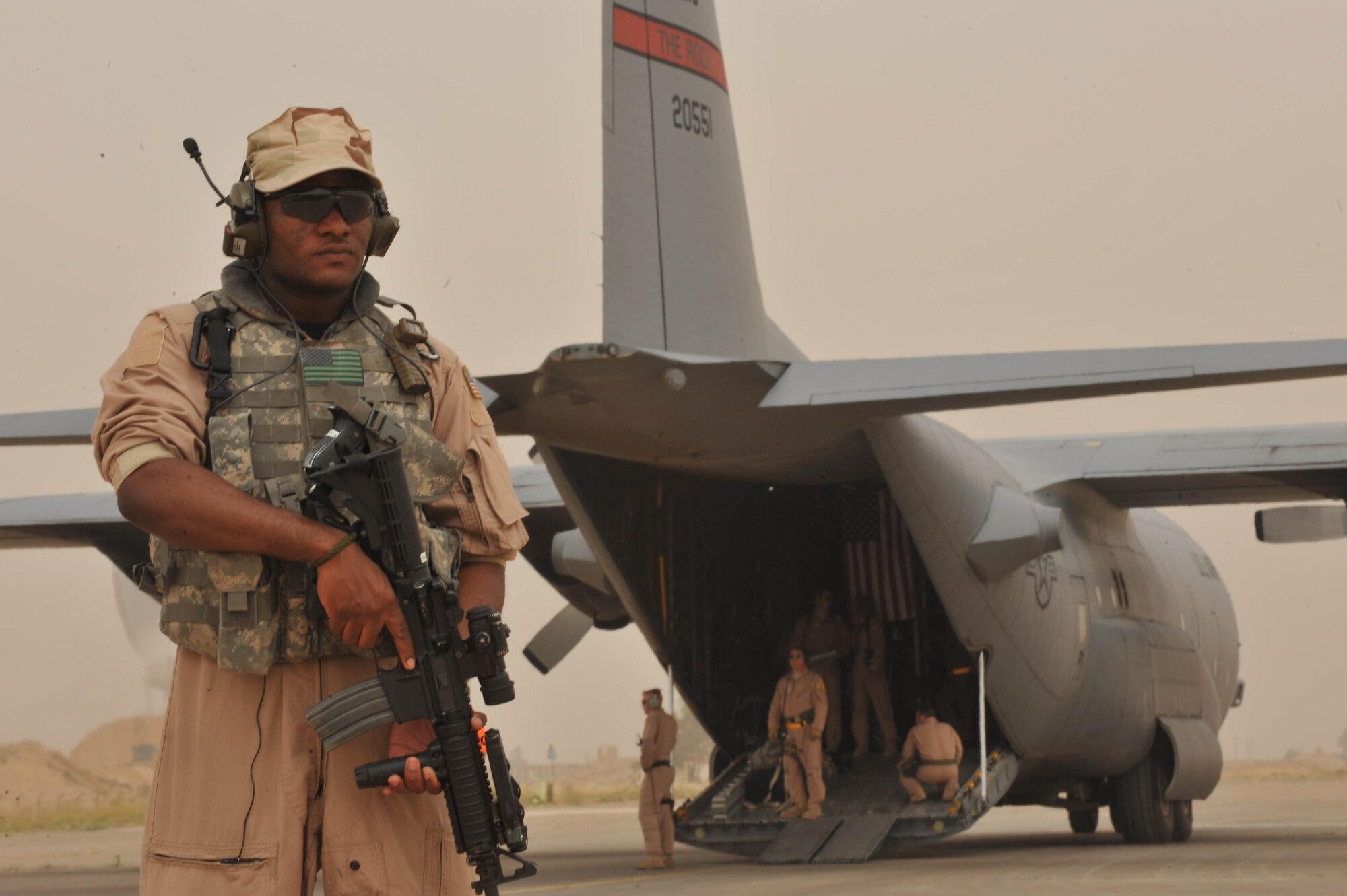 U.S. Air Force security forces member, Senior Airman Melvin Griswold, pulls security for a C-130 Hercules during a aeromedical evacuation stop at Mosul, Iraq, May 13, 2010.  Airman Griswold is a member of the fly-away security team (FAST) and is deployed to the 332nd Expeditionary Security Forces Squadron, Joint Base Balad, Iraq.  (U.S. Air Force photo/Staff Sgt. Quinton Russ/released)