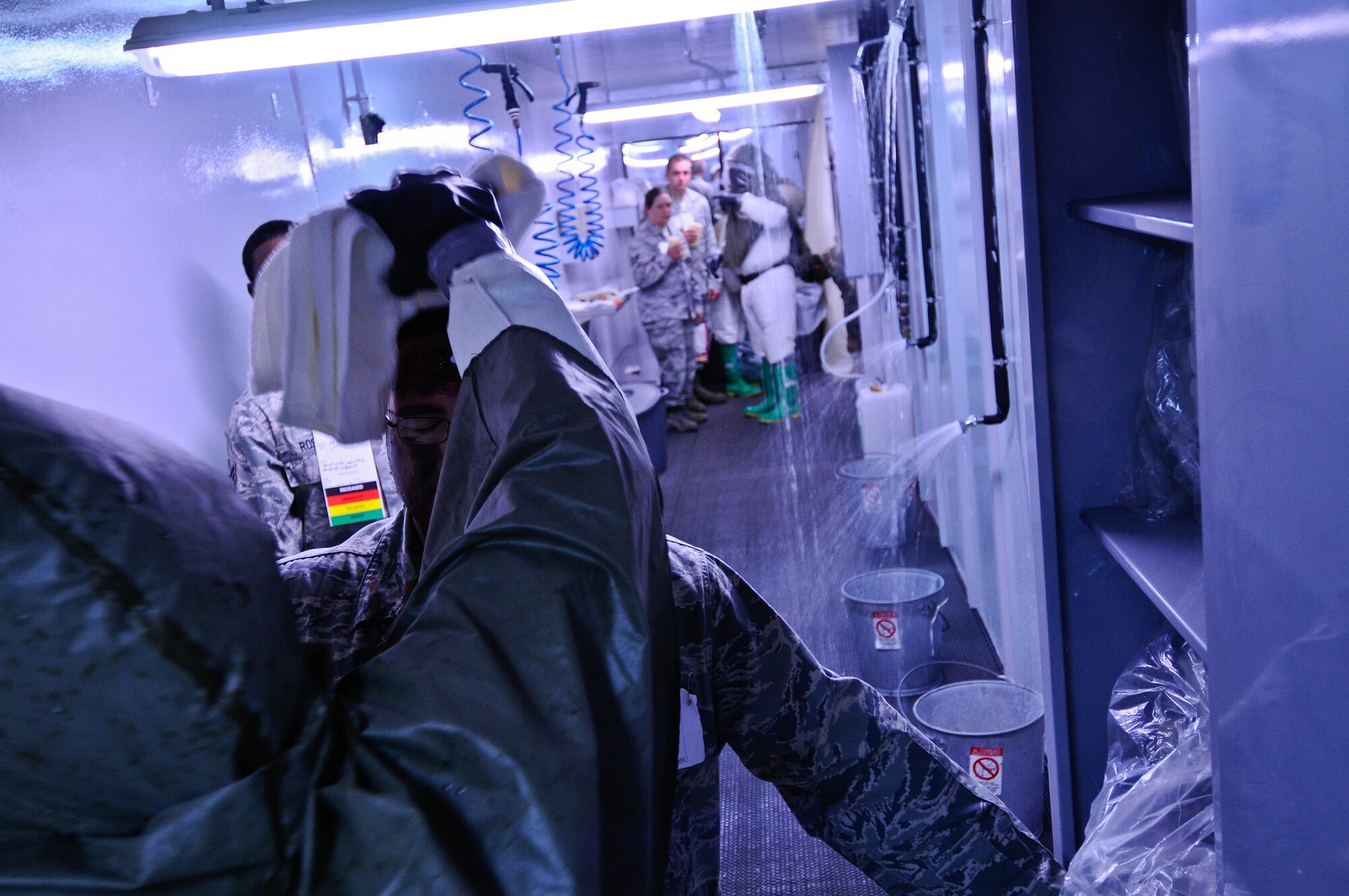 Airmen follow a decontamination line during an anti-terrorism exercise Tuesday, May 25, 2010 at Incirlik Air Base’s Clinic.  The exercise tested the base’s terrorism-response ability.  The base was put into 24-hour operations for the duration of the exercise and accomplished a number of simulated artillery and chemical attacks.  (U.S. Air Force photo/Senior Airman Alexandre Montes)