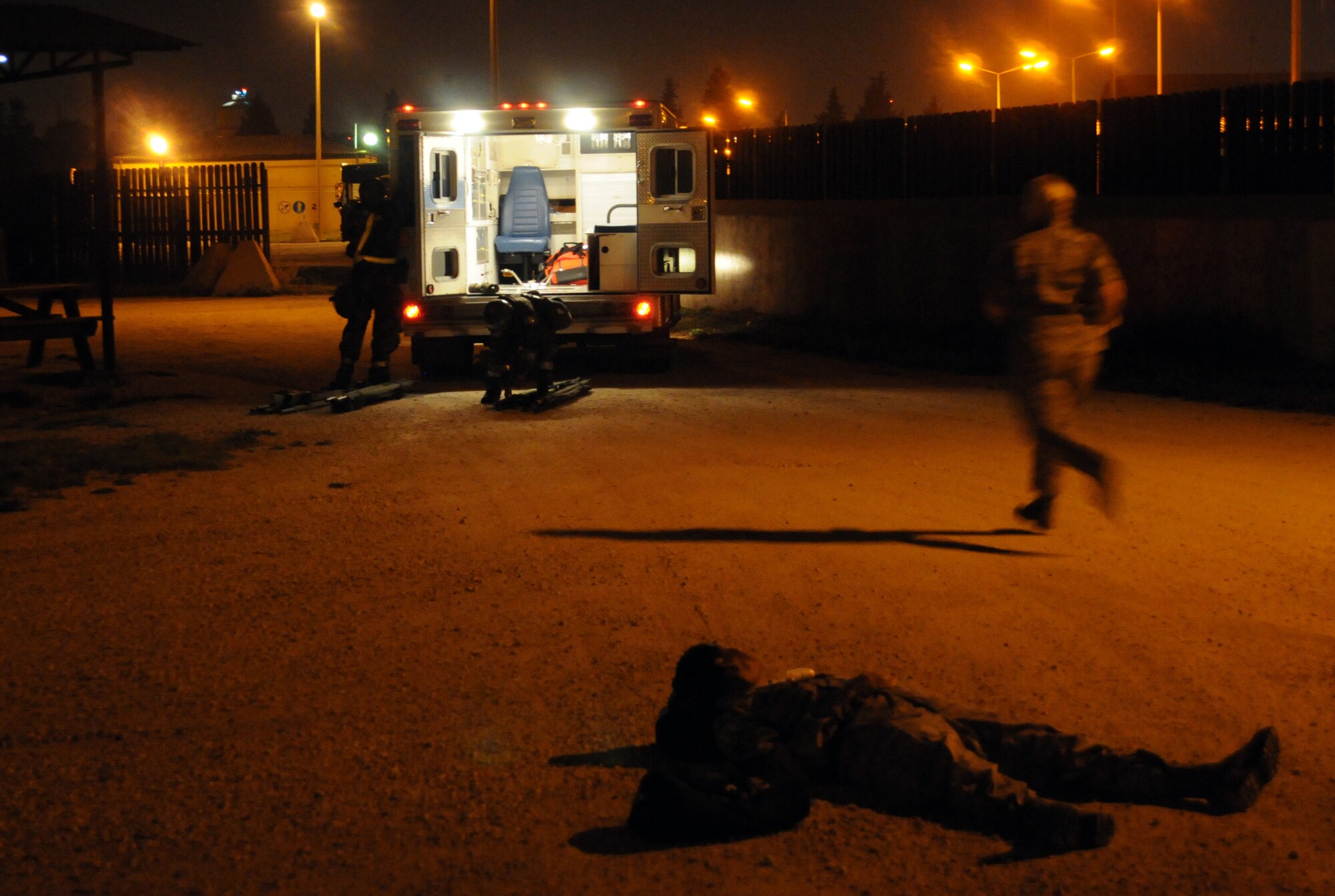 First responders prepare to triage “victims” following a simulated chemical attack during an anti-terrorism exercise Tuesday, May 26, 2010 at Incirlik Air Base’s Patriot Village.  The exercise tested the base’s terrorism-response ability.  The base was put into 24-hour operations for the duration of the exercise and accomplished a number of simulated artillery and chemical attacks.  (U.S. Air Force photo/Staff Sgt. Raymond Hoy)
