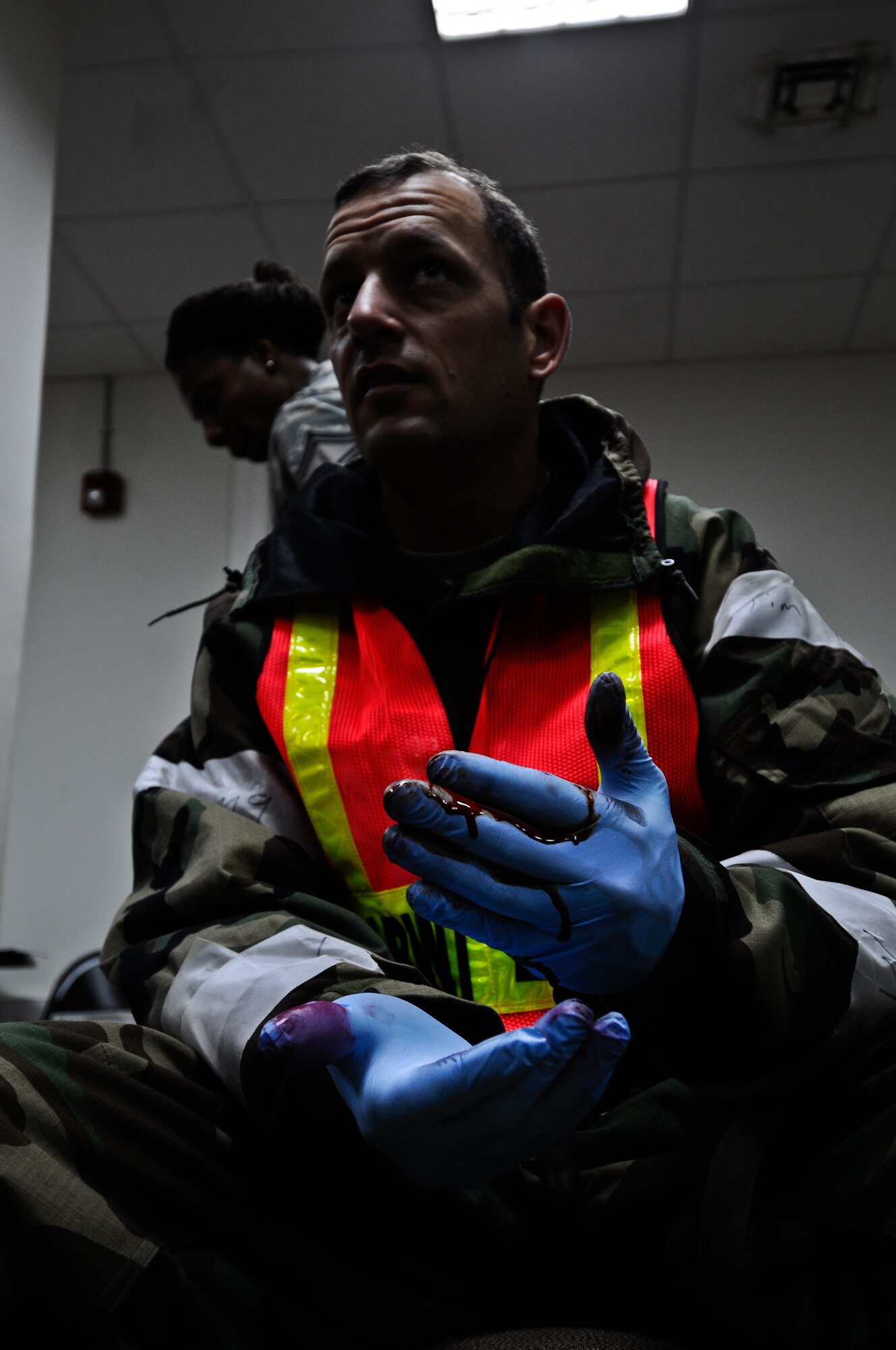 Maj. Robert Colella, 39th Medical Operations Squadron, waits for his next exercise casualty to apply make-up prior to an anti-terrorism exercise Tuesday, May 25, 2010 at Incirlik Air Base.  The exercise tested the base’s terrorism-response ability.  The base was put into 24-hour operations for the duration of the exercise and accomplished a number of simulated artillery and chemical attacks.  (U.S. Air Force photo/Senior Airman Alexandre Montes)
