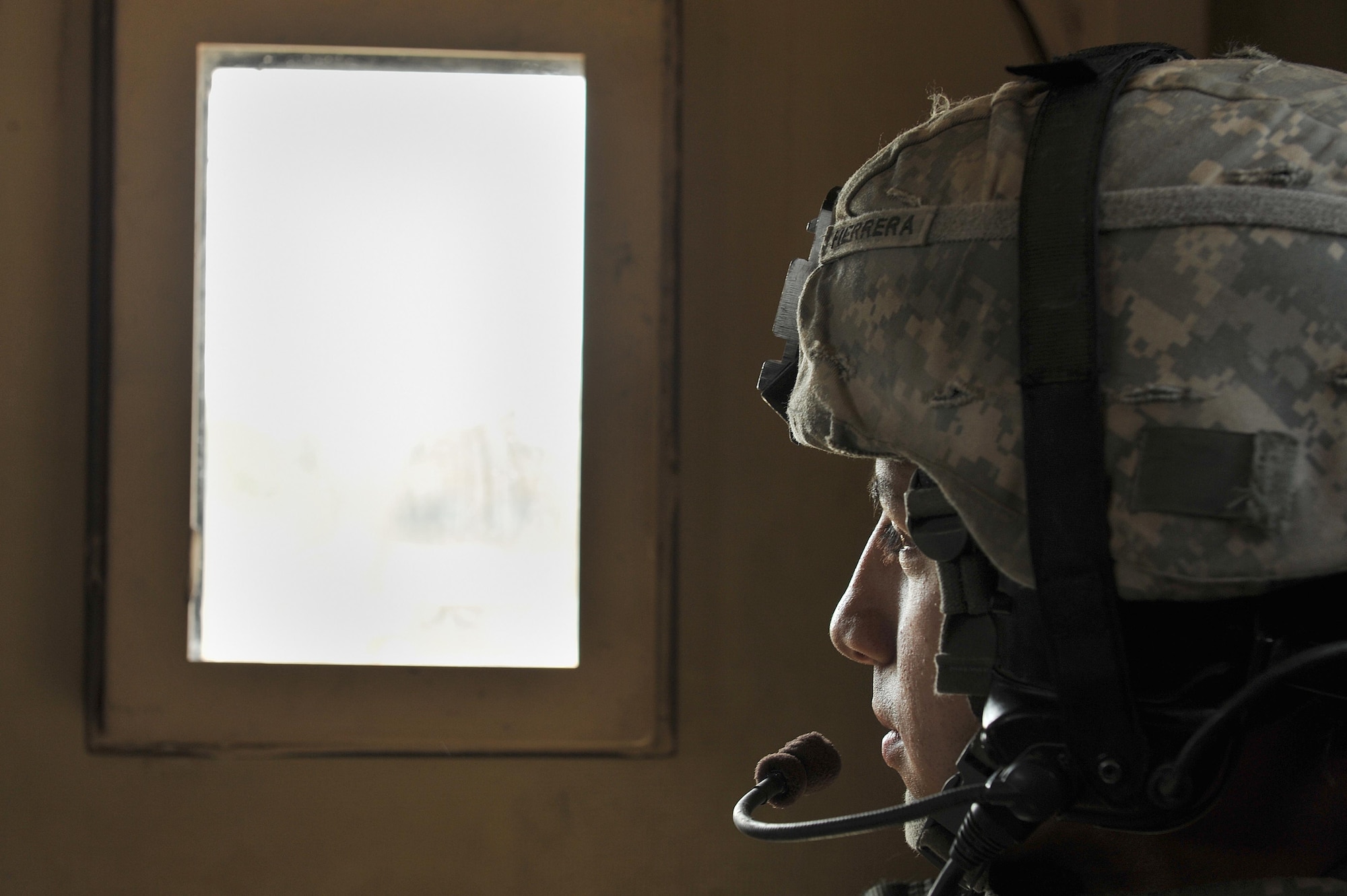 U.S. Army Pfc. Jose Herrera rides in a mine resistant ambush protected (MRAP) vehicle while on a mission from Joint Base Balad, May 7, 2010.  Private Herrera is assigned to 1st Battalion, 28th Infantry, Delta Company Black Lions, 3rd Platoon, from Ft. Riley, Kan.  (U.S. Air Force photo/Staff Sgt Quinton Russ/released)