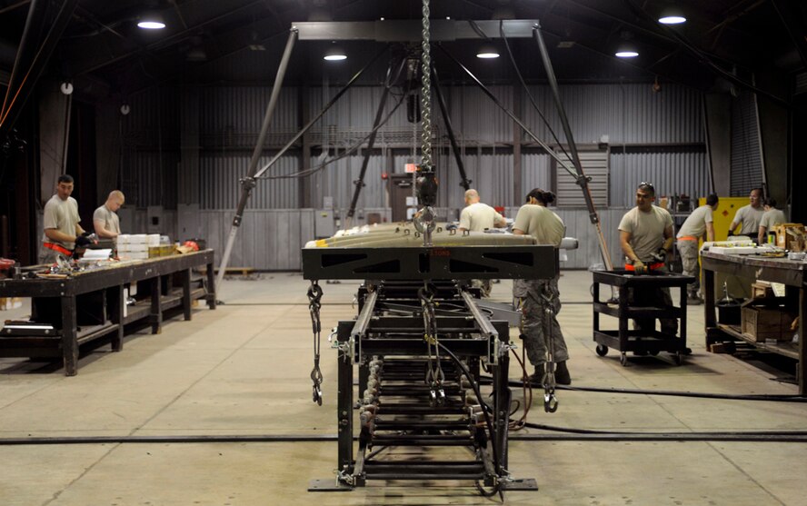Munitions maintainers from across Pacific Air Forces assemble MK82 munitions during the Combat Ammunitions Production Exercise at Osan Air Base, Republic of Korea, May 25. CAPEX is a 24 hour, non-rated exercise held once a year in PACAF. It provides training on non-nuclear reserve munitions production in integrated tasks orders and planning. The exercise had not been held at Osan since 2006. (U.S. Air Force photo/Staff Sgt. Stephenie Wade)