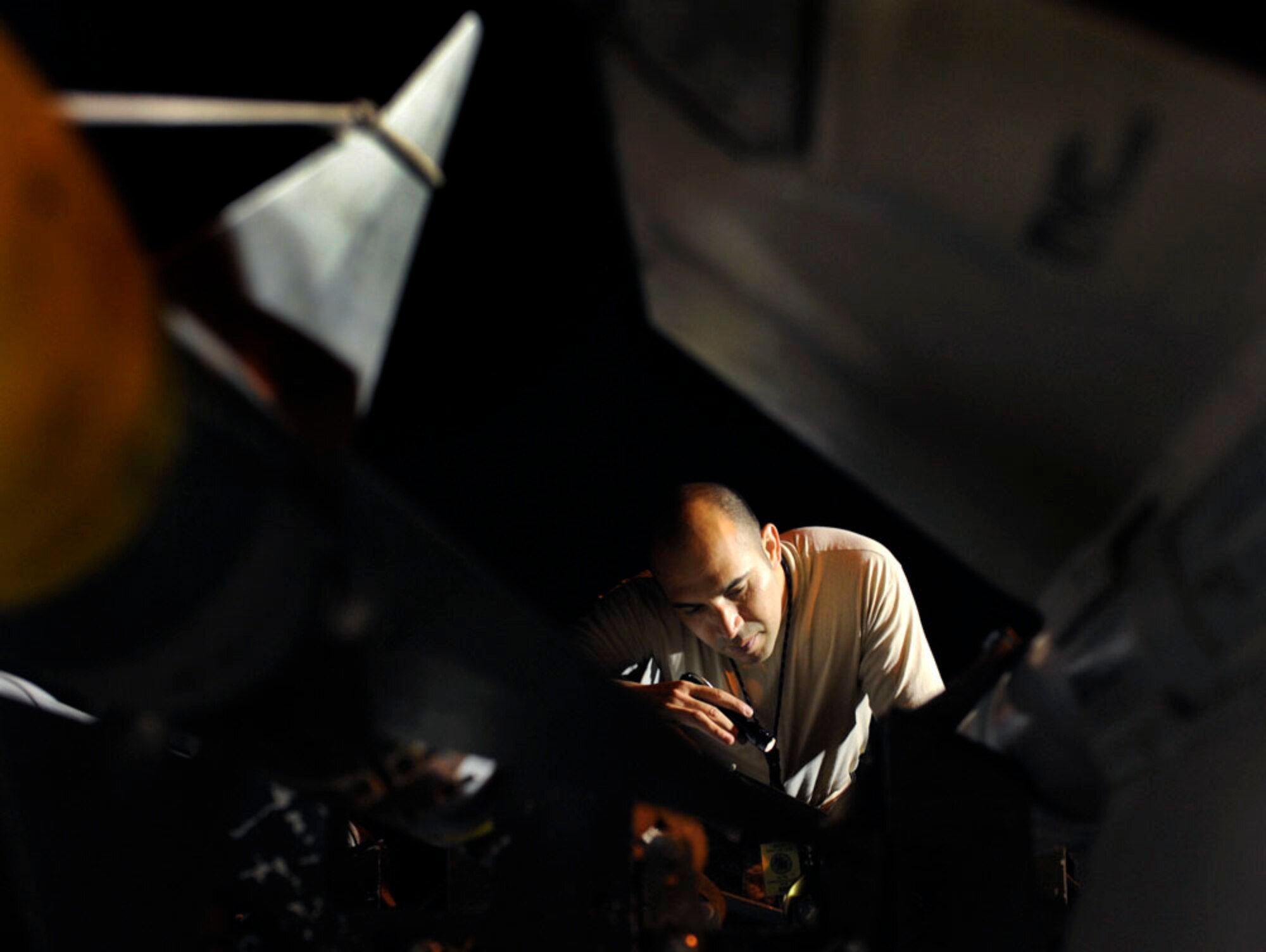 Tech. Sgt. Johnny Rodriquez checks GBU12 munitions for technical accuracy in the in-check area of the bomb dump during the Combat Ammunitions Production Exercise at Osan Air Base, Republic of Korea, May 25. Sergeant Rodriquez is a munitions maintainer from the 51 Munitions Squadron at Osan. CAPEX is a non-rated exercise held once a year in the Pacific Air Force region. It provides training on non-nuclear reserve munitions production in integrated tasks orders and planning. The exercise had not been held at Osan since 2006. (U.S. Air Force photo/Staff Sgt. Stephenie Wade)