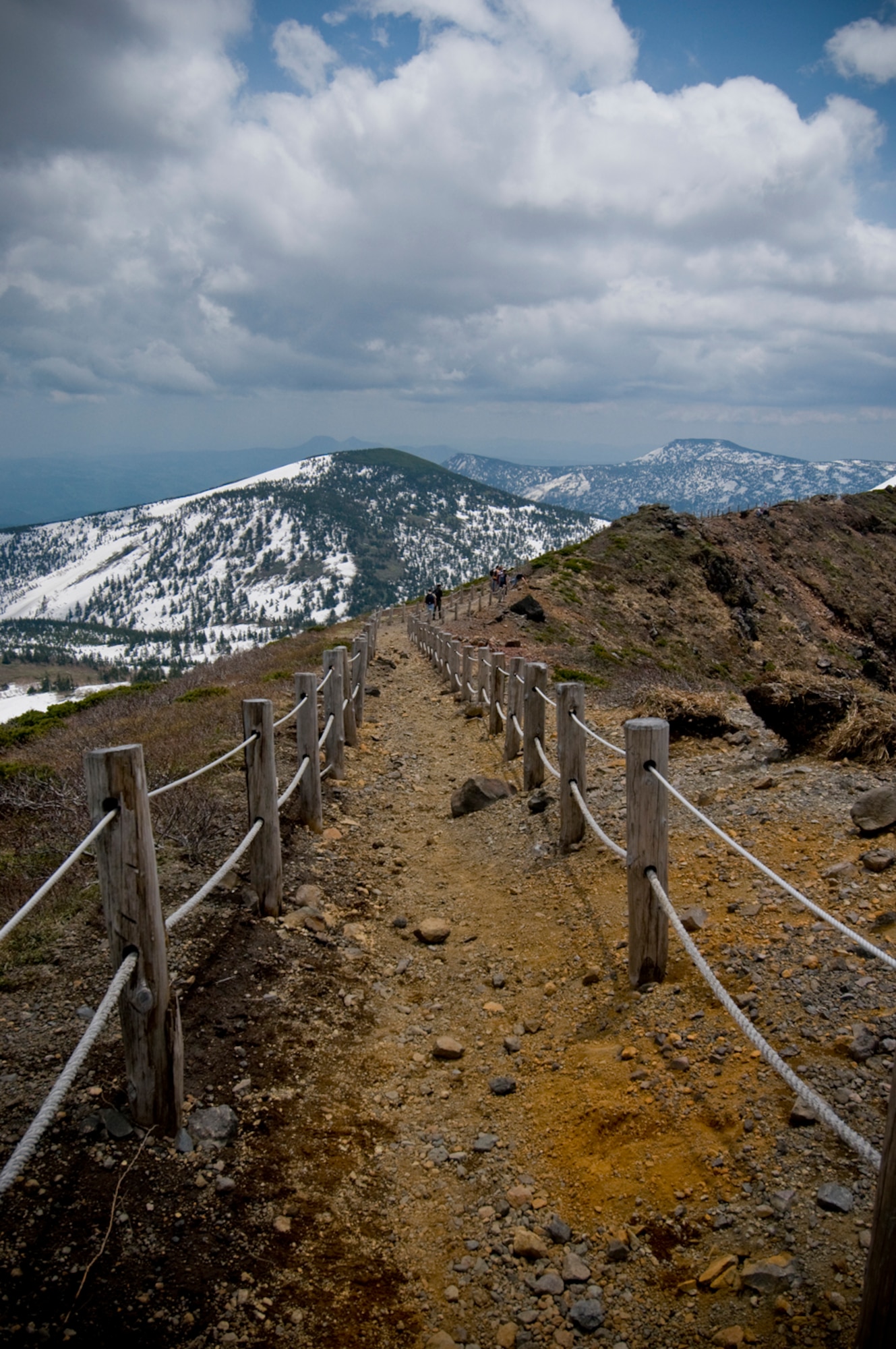 A trail stretches across parts of northern Japan’s Hakkoda mountain range. First-term Airmen from Misawa Air Base, Japan, see scenic views May 22, during a ropeway and hiking trip, offered by the 35th Force Support Squadron Outdoor Recreation center’s Pacific Air Forces Command’s Ultimate Airman Adventure. The program kicked off the first of several scheduled outdoor excursions during the summer. (U.S. Air Force photo/Senior Airman Jessica Lockoski)