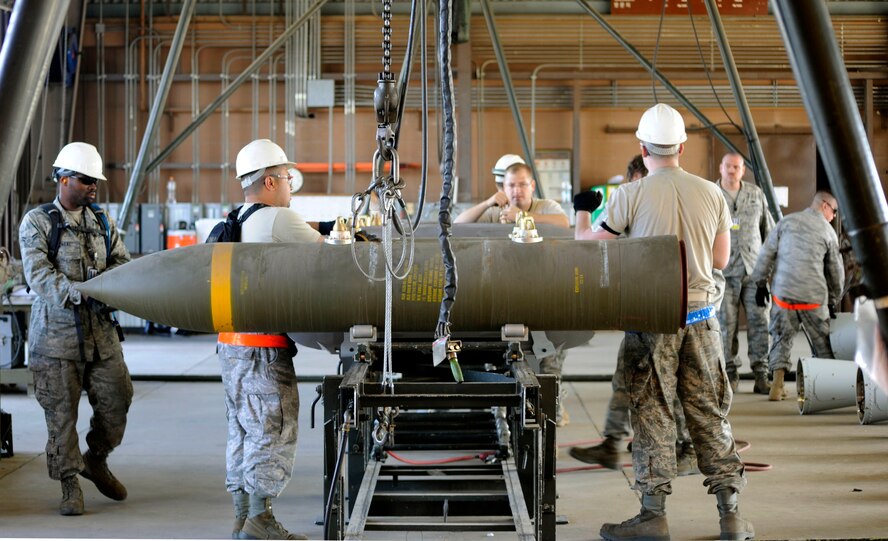 Multiple munitions maintainers from around the Pacific assemble BLU-109 munitions in the small bomb pad during the Combat Ammunitions Production Exercise at Osan Air Base, Republic of Korea, May 25. CAPEX is a non-rated exercise held once a year in the Pacific Air Force region. It provides training on non-nuclear reserve munitions production in integrated tasks orders and planning. The exercise had not been held at Osan since 2006. (U.S. Air Force photo/Staff Sgt. Stephenie Wade)