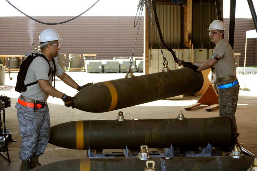 Senior Airmen Travis Talley, left, and Derek White load BLU-109 munitions on to a rolling rack to be assembled during the Combat Ammunitions Production Exercise at Osan Air Base, Republic of Korea, May 25. Airman Talley is a munitions maintainer from the 51st Munitions Squadron and Airman White is from the 35th Munitions Squadron at Misawa Air Base, Japan. CAPEX is a non-rated exercise held once a year in the Pacific Air Force region. It provides training on non-nuclear reserve munitions production in integrated tasks orders and planning. (U.S. Air Force photo/Staff Sgt. Stephenie Wade)