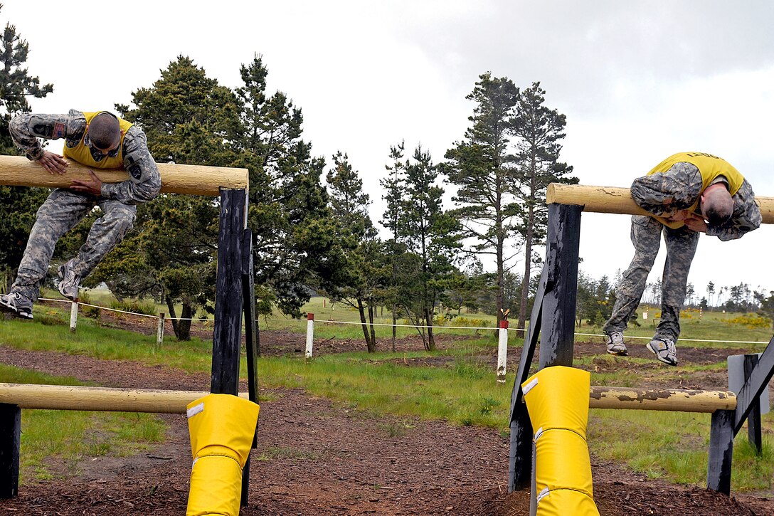 Two U.S. Army soldiers participate in the obstacle course event during the 2010 Oregon Army National Guard's Best Warrior Competition on Camp Rilea in Warrenton, Ore., May 22, 2010. Seventeen of Oregon's best soldiers and noncommissioned officers are competing for the title of Oregon's Best Warrior, and a chance to move ahead to the regional competition in Alaska later this year.