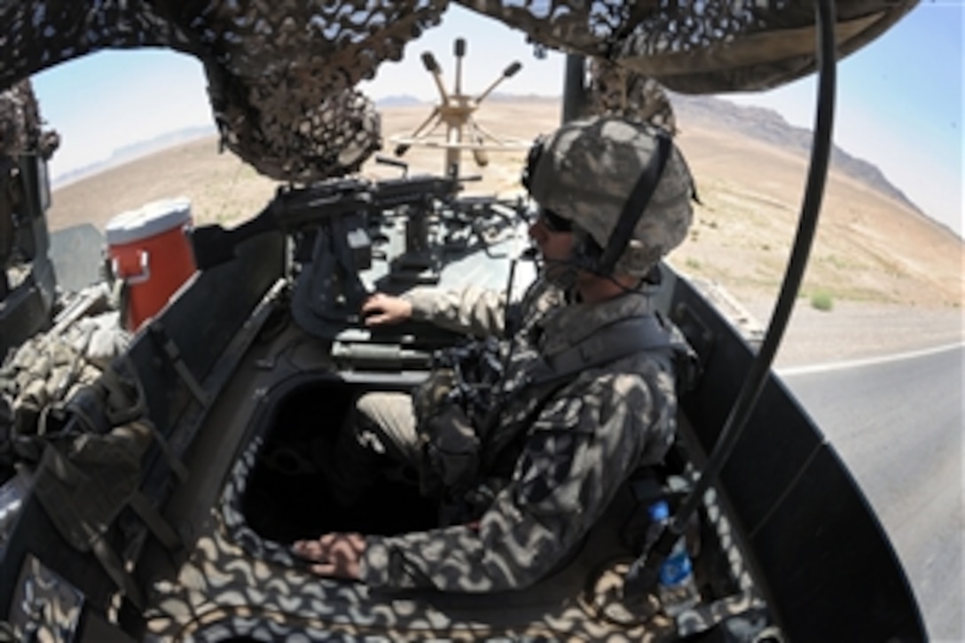 U.S. Army 1st Lt. David Leydet, from 3rd Platoon, Bear Troop, 8th Squadron, 1st Calvary Regiment, 5th Brigade Combat Team, 2nd Infantry Division, mans the hatch of a Light Armored Vehicle III during the return to Forward Operating Base Blackhawk in Spin Boldak, Afghanistan, on May 13, 2010.  