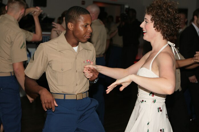 U.S. and Canadian Service Members  attend the USO Swinging Salute to our Troops Fleet Week kick off with Paris Hiton at The Union Square Ballroom, May 26, 2010.  More than 3,000 Marines, Sailors and Coast Guardsmen will be in the area participating in community outreach events and equipment demonstrations. This is the 26th year New York City has hosted the sea services for Fleet Week.(U.S. Marine Corps photo by Cpl. Patrick P. Evenson)