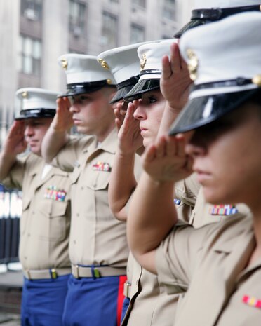 NEW YORK -- Marines from Special Purpose Marine Ground Task Force New York raise the morning colors at Trinity Church, the burial site of Lt. Col. Wharton, 3rd Commandant of the Marine Corps. More than 3,000 Marines, Sailors and Coast Guardsmen will be in the area participating in community outreach events and equipment demonstrations. This is the 26th year New York City has hosted the sea services for Fleet Week.