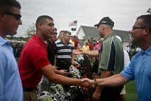 FARMINGDALE, N.J. - Marines with Special Marine Air Ground Task Force New York  meet their golf partners during the Eagle Oaks Golf and Country Club Honor Day in Farmingdale, N.J., May 27.  The annual Fleet Week event brought some 200 Marines and Sailors to the club for a day of golf and relaxation. More than 3,000 Marines, Sailors and Coast Guardsmen will be in the area participating in community outreach events and equipment demonstrations. This is the 26th year New York City has hosted the sea services for Fleet Week.::n::(Official Marine Corps Photo by Lance Cpl. Jad Sleiman)