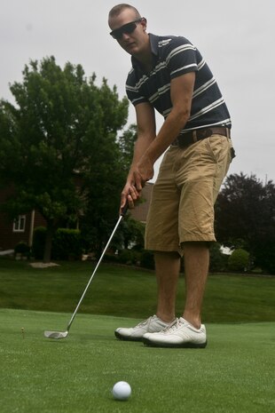 FARMINGDALE, N.J. - A Marine with Special Marine Air Ground Task Force New York attempts a delicate putt during  the Eagle Oaks Golf and Country Club Honor Day in Farmingdale, N.J. May 27. The annual Fleet Week event brought some 200 Marines and Sailors to the club for a day of golf and relaxation. More than 3,000 Marines, Sailors and Coast Guardsmen will be in the area participating in community outreach events and equipment demonstrations. This is the 26th year New York City has hosted the sea services for Fleet Week.::n::(Official Marine Corps Photo by Lance Cpl. Jad Sleiman)