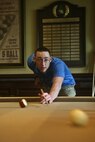 FARMINGDALE, N.J. - Lance Cpl. Sean Leyda plays pool during the Eagle Oaks Golf and Country Club Honor Day in Farmingdale, N.J., May 27. The annual Fleet Week event brought some 200 Marines and Sailors to the club for a day of golf and relaxation followed by a dinner party in their honor. More than 3,000 Marines, Sailors and Coast Guardsmen will be in the area participating in community outreach events and equipment demonstrations. This is the 26th year New York City has hosted the sea services for Fleet Week.::n::(Official Marine Corps Photo by Lance Cpl. Jad Sleiman)
