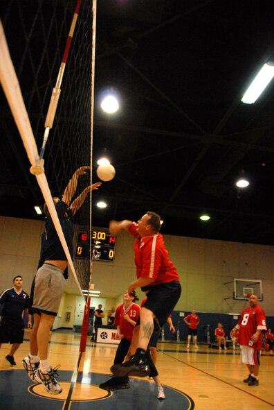The members of Fourth Air Force/Air Marine Operations Center team were the victors in the championship volleyball game against the 163rd Reconnaissance Wing team. The league, which began Feb. 23, had 102 players on six teams, which is a two-team increase from the previous three years. Team practices were held based on team members’ availability, with games on Tuesdays and Thursdays at 5:30 p.m. and 6:15 p.m. The 4 AF/AMOC team also earned a trophy for having the best standings in the league at the end of the season. (U.S. Air Force photo by Staff Sgt Paul Duquette)