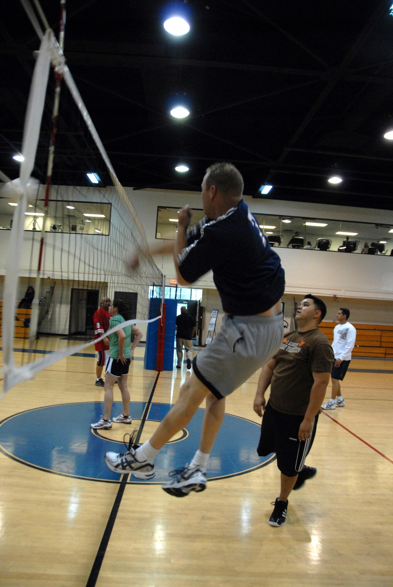 1st Lt. Perry Covington, 163rd RW. The members of Fourth Air Force/Air Marine Operations Center team were the victors in the championship volleyball game against the 163rd Reconnaissance Wing team. The league, which began Feb. 23, had 102 players on six teams, which is a two-team increase from the previous three years. Team practices were held based on team members’ availability, with games on Tuesdays and Thursdays at 5:30 p.m. and 6:15 p.m. The 4 AF/AMOC team also earned a trophy for having the best standings in the league at the end of the season. (U.S. Air Force photo by Staff Sgt Paul Duquette)
