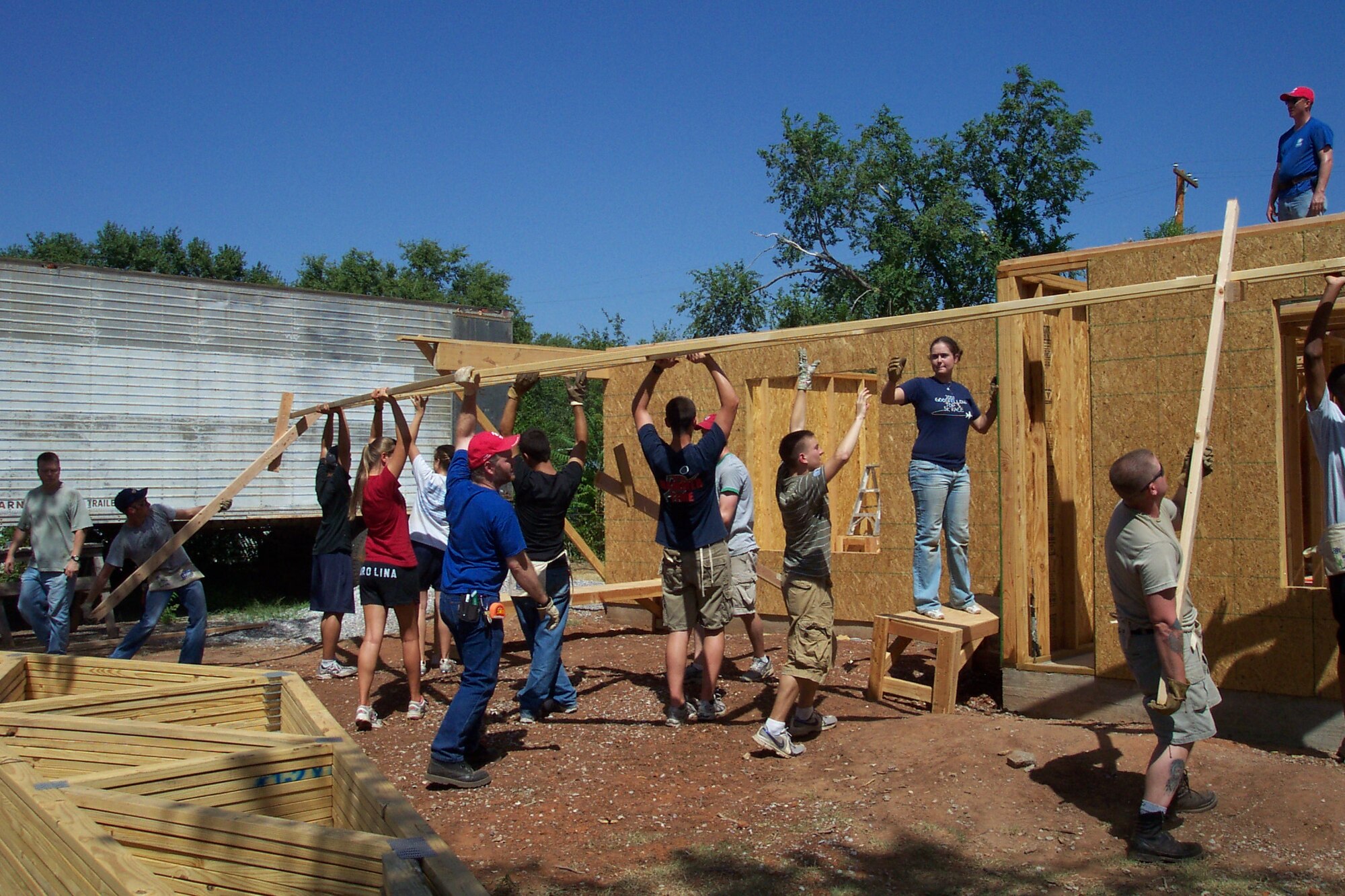ALTUS AIR FORCE BASE, Okla. -- Base and community volunteers help build a Habitat for Humanity home in the town of Altus. They installed wooden trusses which will form the roof of the house. (Courtesy photo)

