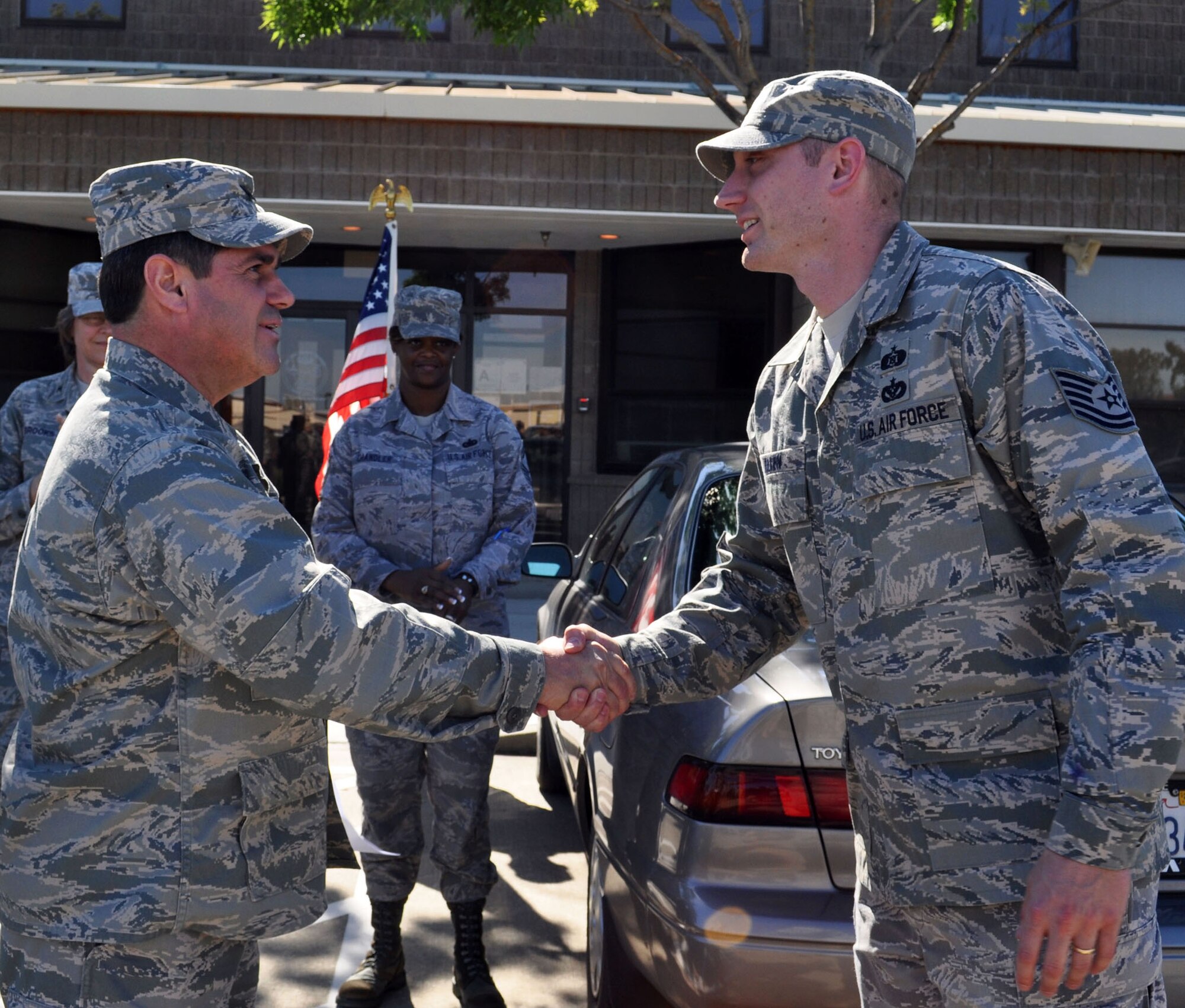 TRAVIS AIR FORCE BASE, Calif. -- Tech. Sgt. Robert Allen, 349th Civil Engineer Squadron, receives a 4th Air Force Commander's coin for superior performance from Col. Barrett Brousssard, 349th Air Mobility Wing vice commander May 2. A higher headquarters team made a staff assistance visit to the wing Apr. 28 - May 2 to assist in preparation for the 2011 operational readiness inspection. The numbered air force commander, Maj. Gen. Eric Crabtree, traditionally recognizes individual superior performance of duty with presentation of his personal coin. Sergeant Allen was one of four 349th CES Airmen coined. (U.S. Air Force photo/Senior Master Sgt. Ellen L. Hatfield)