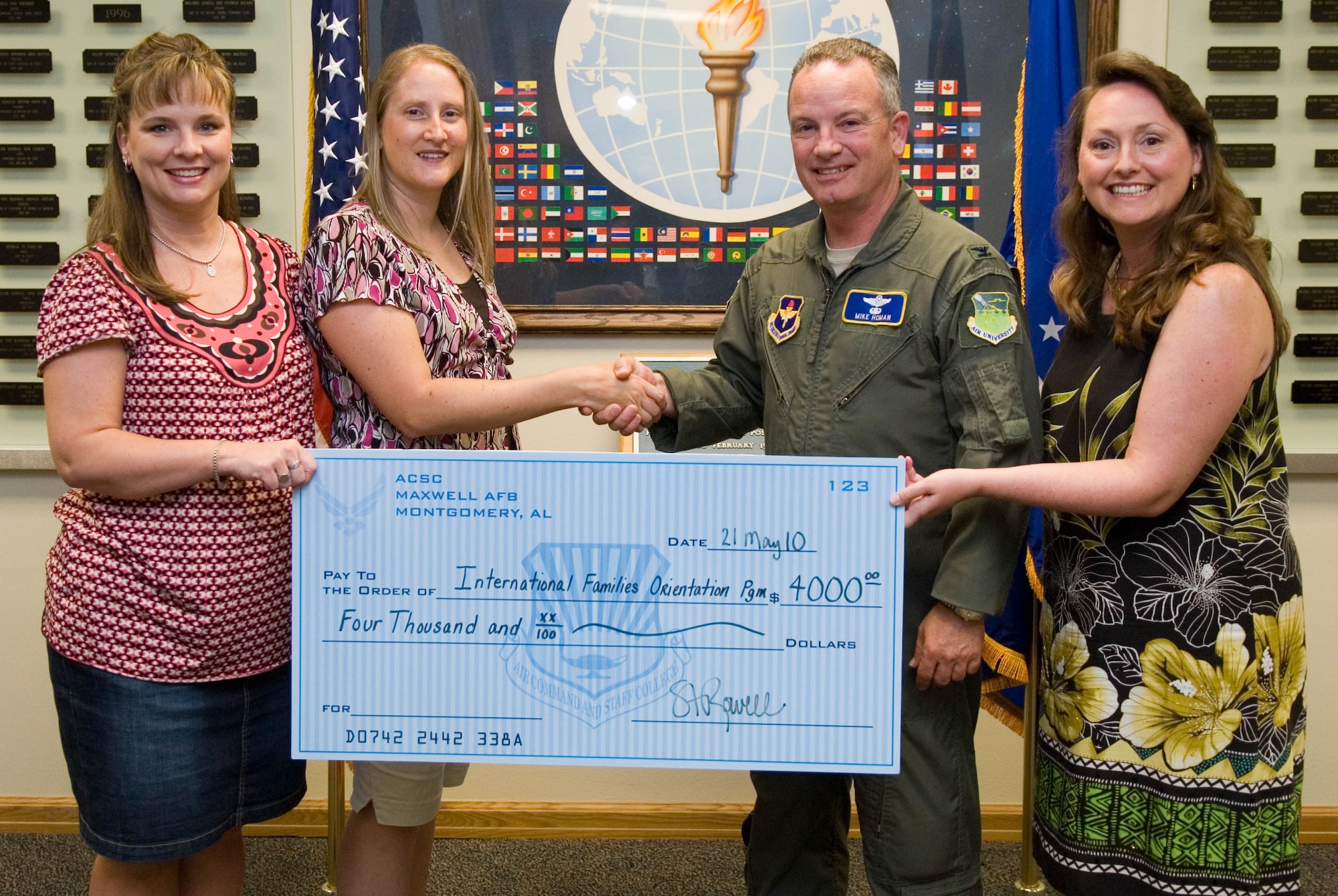 The International Family Orientation Program received a $4,000 donation last week from the Air Command and Staff College spouses’ group. 

From left, Staci Rowell, Heather Forrest, Col. Michael Homan, International Officers School commander, and Laura Pate. 

IFOP is a two-week program for the families of Air War College and Air Command and Staff College international students. The program orients families to the area and eases the stress of relocating to the United States. This year’s IFOP is June 21-30 at Maxwell Elementary School. 

The program is volunteer supported and funded by donations from various Maxwell-Gunter groups. (U.S. Air Force/Stephen Hynes)