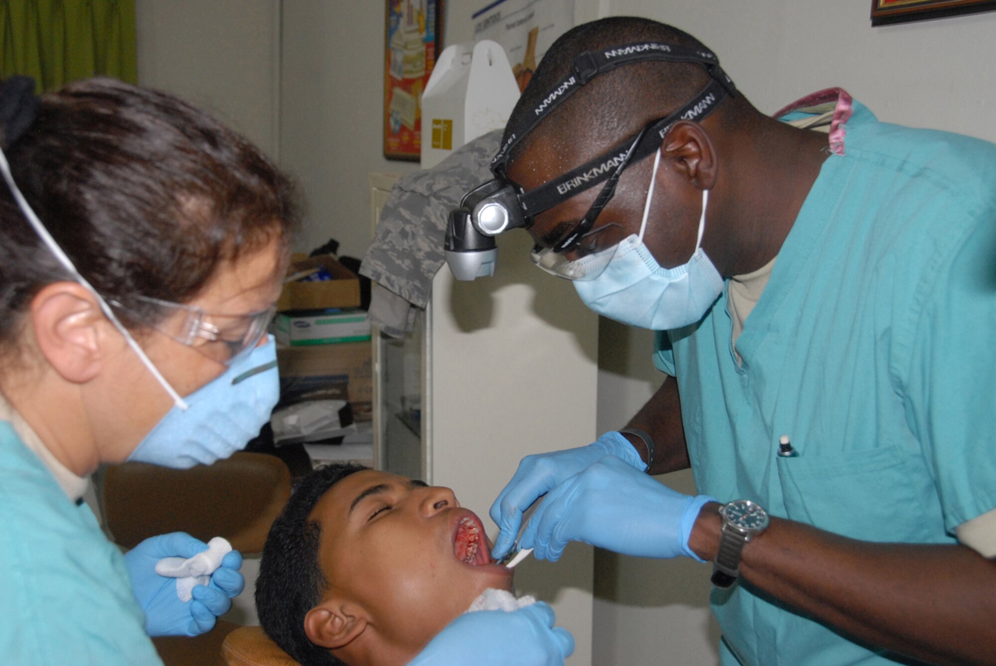 Capt. (Dr.) Jonathan Johnson, a dentist from the 622nd Aeromedical Staging Squadron, Robins Air Force Base, Ga., extracts a tooth during MEDRETE 2010 Dominican Republic on May 24, 2010. A team of 39 medical specialists from Air Force Reserve Command is providing medical care to four towns in the Puerto Plata region of the country. (U.S. Air Force photo/Master Sgt. Chance C. Babin)