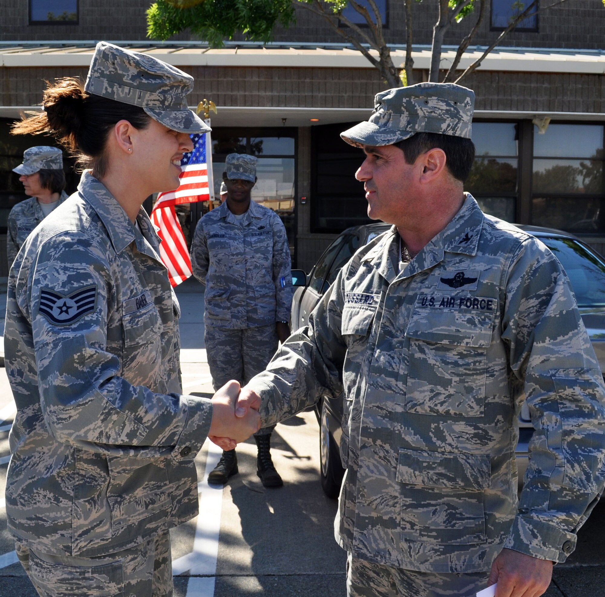 TRAVIS AIR FORCE BASE, Calif, -- Tech. Sgt. Ana Baber was one of four 349th Civil Engineer Squadron Airmen singled out for superior performance by 4th Air Force commander, Maj. Gen. Eric Crabtree, during the staff assistance visit of Apr. 28 - May 2. Col. Barrett Broussard, 349th Air Mobility Wing vice commander, presented four coins to CES Airmen during a surprise visit May 2. Higher headquarters SAVs help prepare the wing for the future operational readiness inspections, and individual stellar performance is always rewarded. (U.S. Air Force photo/Senior Master Sgt. Ellen L. Hatfield)