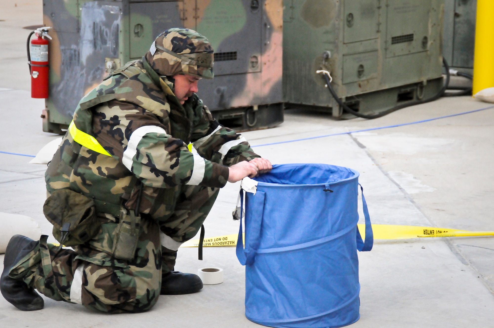 Tech. Sgt. Kelley Blair of the Kentucky Air Guard's 123rd Airlift Wing sets up a chemical warfare decontamination station May 21, 2010 at the Gulfport Combat Readiness Training Center in Gulfport, Miss. The 123rd and two other units were being evaluated by the Air Mobility Command Inspector General as part of an Operational Readiness Inspection. (U.S. Air Force photo/Tech. Sgt. Dennis Flora)(Released)