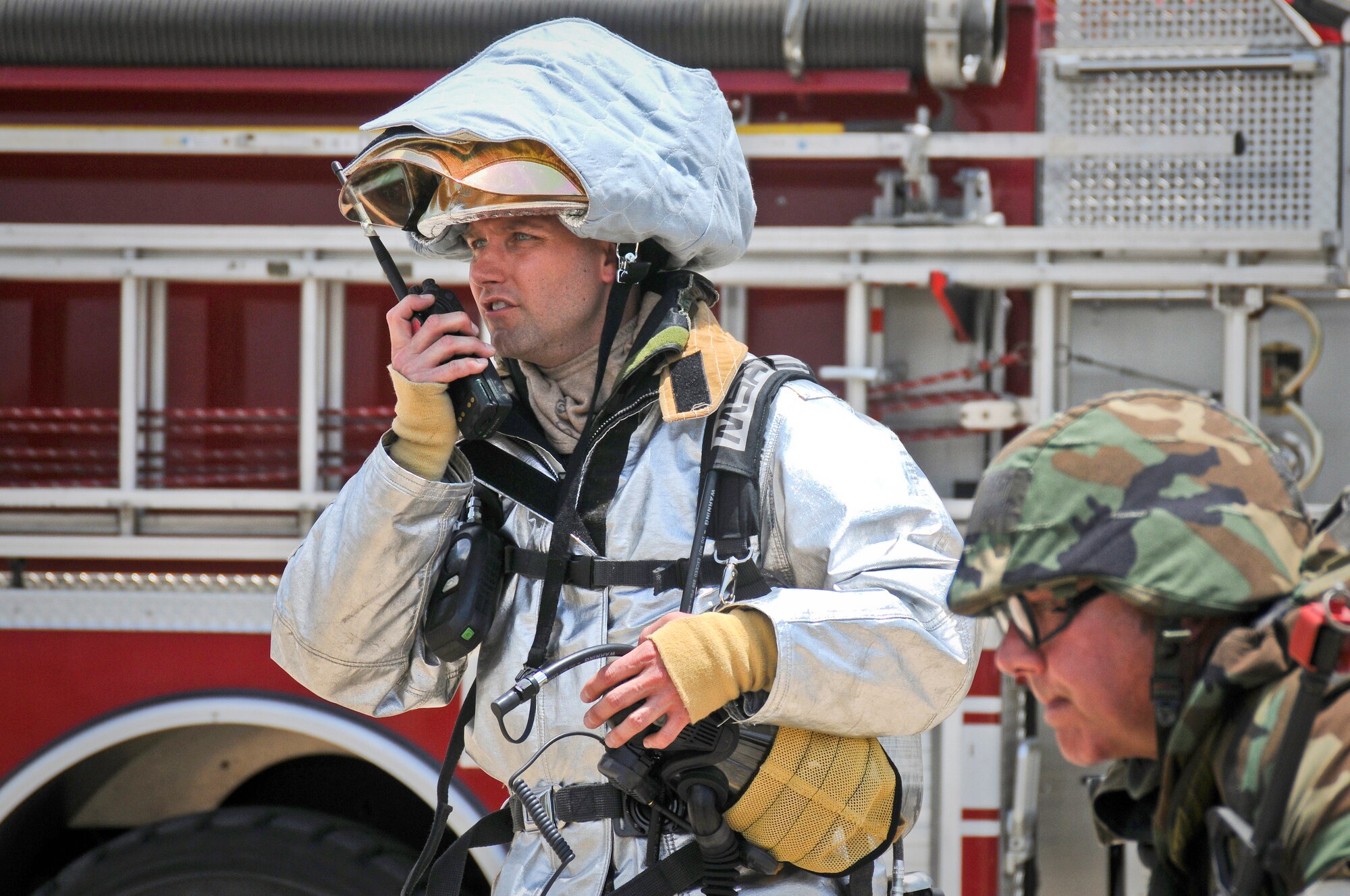 Staff Sgt. Ronald Renner, a firefighter from the 123rd Airlift Wing Fire Department, directs the response to a simulated fire at the Gulfport Combat Readiness Training Center in Gulfport, Miss., on May 20, 2010. The fire broke out after a simulated attack by terrorists as part of an Operational Readiness Inspection. The 123rd and two other units were evaluated during the inspection, conducted by the Air Mobility Command Inspector General. (U.S. Air Force photo/Tech. Sgt. Dennis Flora) (Released)