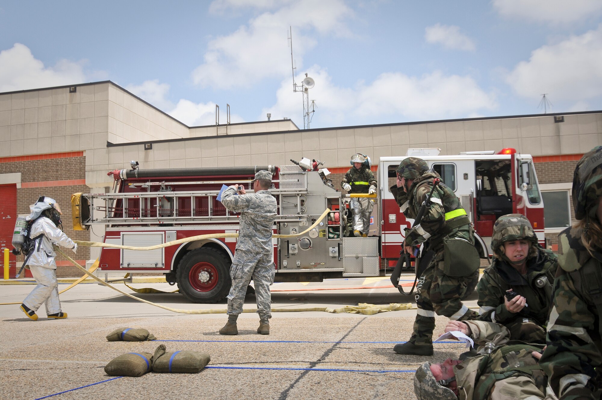Members of the 123rd Airlift Wing Fire Department respond to a simulated fire at the Gulfport Combat Readiness Training Center in Gulfport, Miss., on May 20, 2010. The wing and two other units were being evaluated by the Air Mobility Command Inspector General as part of the first-ever homeland security/homeland defense Operational Readiness Inspection. (U.S. Air Force photo/Tech. Sgt. Dennis Flora) (Released)