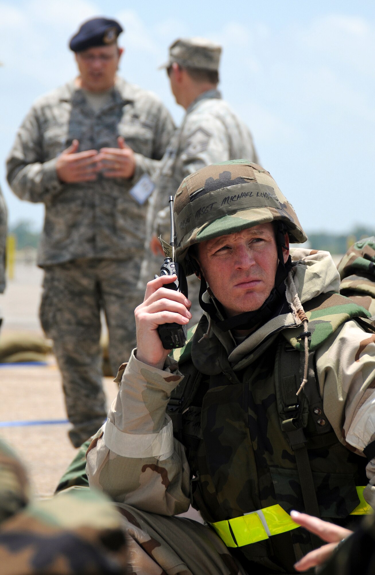 Master Sgt. Michael Ludke, an Nuclear-Biological-Chemical Warfare cell chief from the 123rd Airlift Wing, upchannels information during an evacuation of his building following a simulated attack May 20, 2010 at the Gulfport Combat Readiness Training Center in Gulfport, Miss. The 123rd and two other units were being evaluated for wartime readiness as part of an Air Mobility Command Operational Readiness Inspection. The ORI was unique in that it marked the first time inspectors evaluated a unit's performance in defense of the United States, using scenarios that played out on American soil rather than a simulated overseas environment. (U.S. Air Force photo/Tech. Sgt. Dennis Flora) (Released)