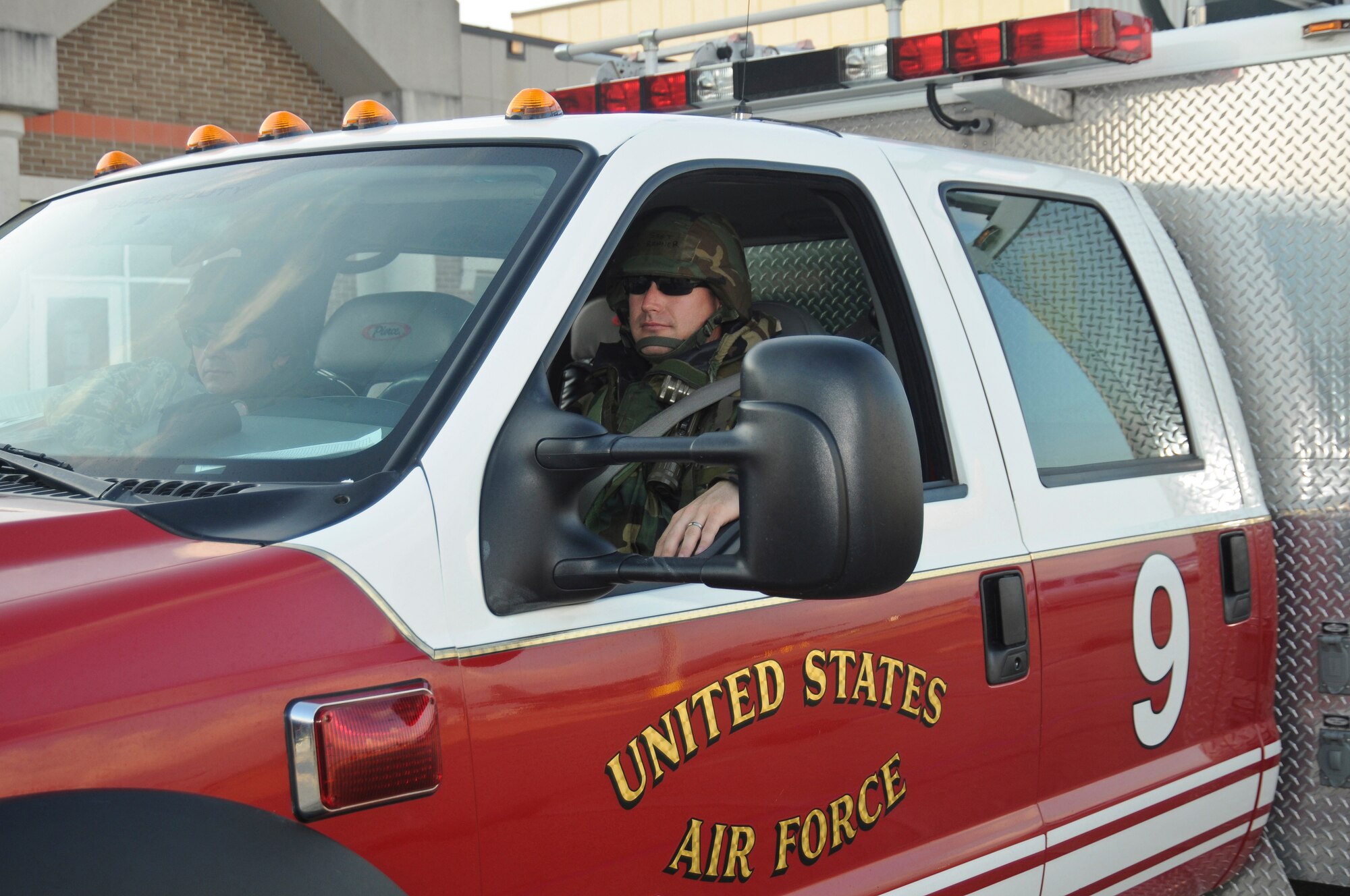 Staff Sgt. Ronald Renner, a firefighter from the 123rd Airlift Wing Fire Department, sits at the ready to respond to any on-base emergencies May 20, 2010 at the Gulfport Combat Readiness Training Center in Gulfport, Miss.  The wing was being evaluated as part of the U.S. Force's first-ever homeland security/homeland defense Operational Readiness Inspection. (U.S. Air Force photo/Tech. Sgt. Dennis Flora) (Released)
