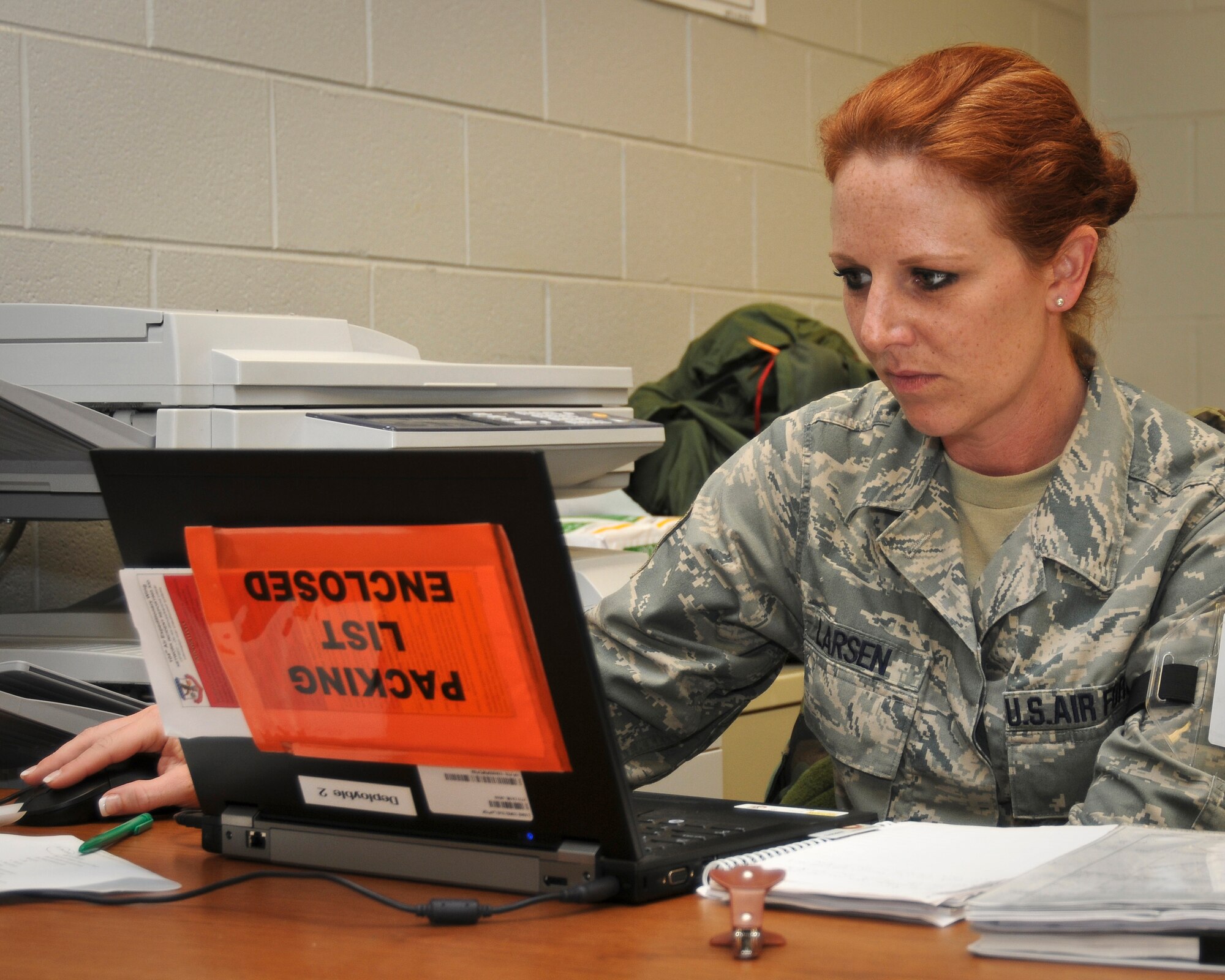 Master Sgt. Melanie Larsen, a paying agent from the Kentucky Air Guard's 123rd Airlift Wing Finance Office, reviews Air Force Instructions on May 19, 2010 at the Gulfport Combat Readiness Training Center in Gulfport, Miss. Sergeant Larsen was participating in an Air Mobility Command Operational Readiness Inspection. (U.S. Air Force photo/Tech. Sgt. Dennis Flora) (Released)