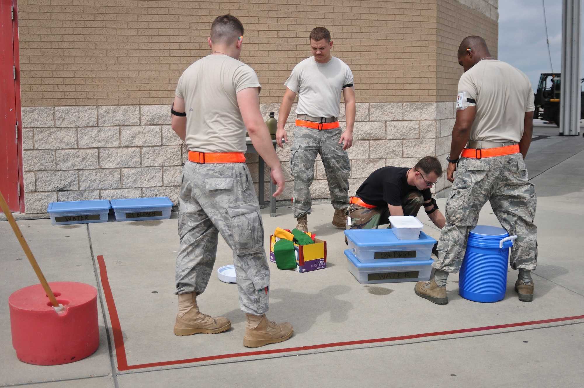 Airmen from the 317th Airlift Group at Dyess Air Force Base, Texas, set up a chemical decontamination station May 19, 2010, at the Gulfport Combat Readiness Training Center in Gulfport, Miss. The Airmen were participating in an Air Mobility Command Operational Readiness Inspection that also included more than 300 troops from the Kentucky Air Guard's 123rd Airlift Wing. The 123rd served as the lead unit for the inspection. (U.S. Air Force photo/Tech. Sgt. Dennis Flora) (Released)