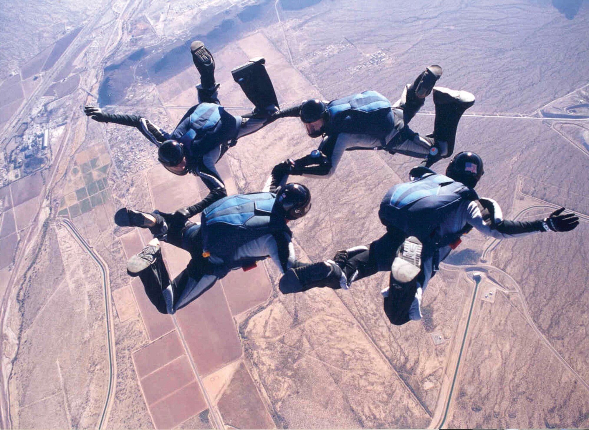 Maj. Olivia Elliott, 303rd Fighter Squadron A-10 Thunderbolt II pilot, participates in the 1999 National Collegiate Skydiving Competition for the USAF Academy Parachute Team, Wings of Blue where she completed more than 500 jumps with the team. The 303rd FS in part of the 442nd Fighter Wing, a reserve unit at Whiteman Air Force Base, Mo. 