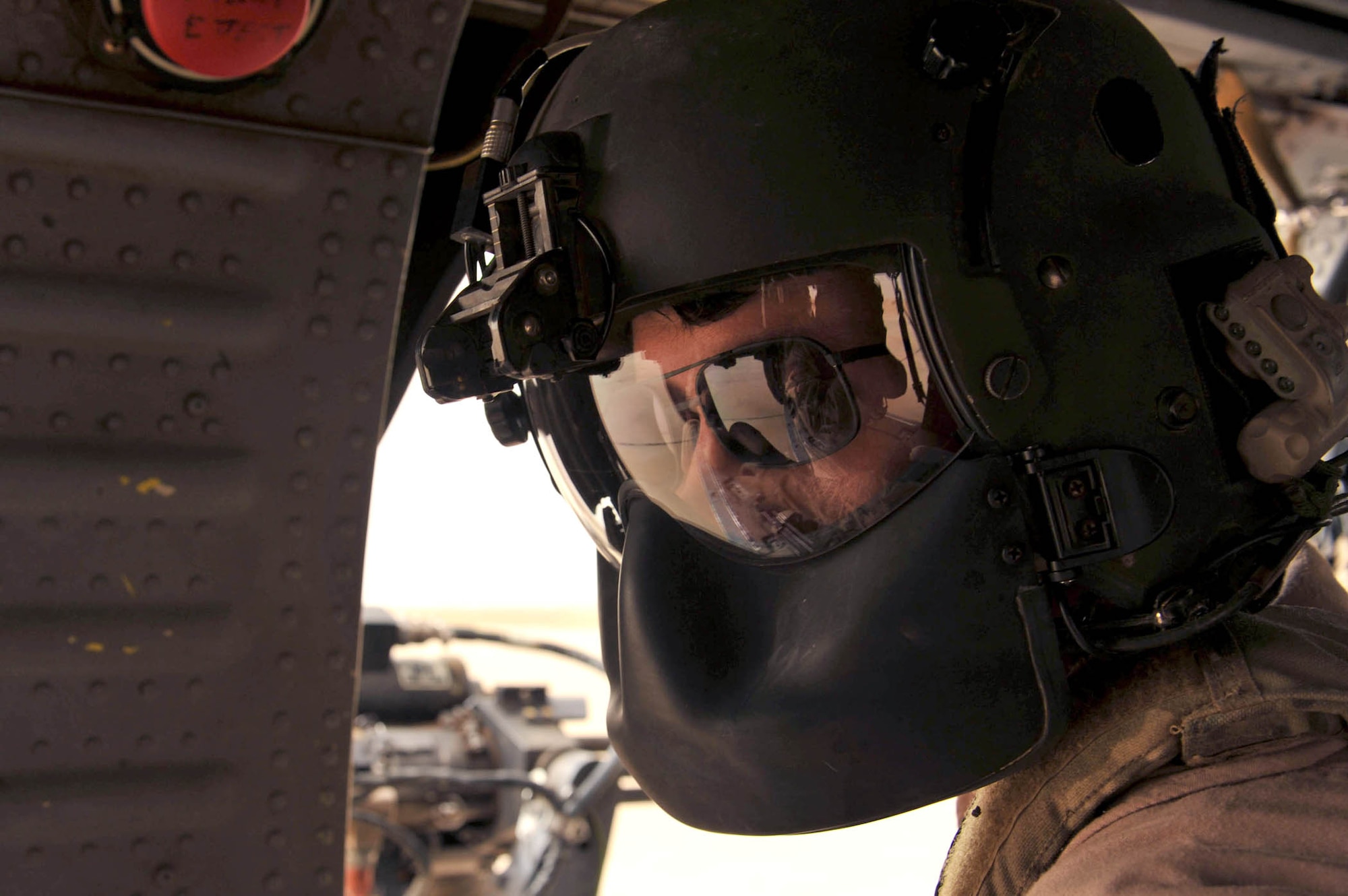 Senior Airman Joseph Arriza checks the cargo compartment of an HH-60G Pave Hawk during a training flight May 15, 2010, near Joint Base Balad, Iraq. Airman Arriza is an aerial gunner assigned to the 64th Expeditionary Rescue Squadron. (U.S. Air Force photo/Staff Sgt. Quinton Russ)
