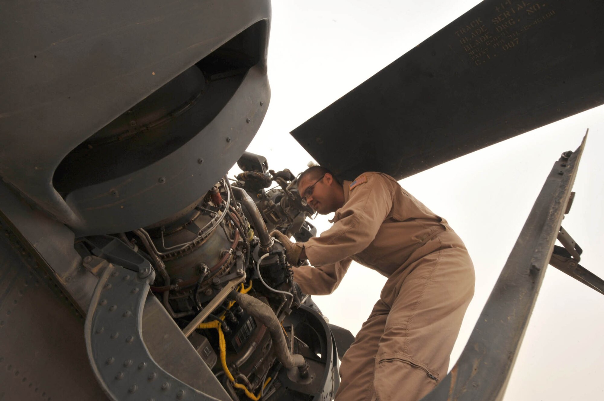 Staff Sgt. Dave Lamica  conducts preflight checks on an HH-60G Pave Hawk before a training flight  May 15, 2010, at Joint Base Balad, Iraq. Sergeant Lamica is a flight engineer assigned to the 64th Expeditionary Rescue Squadron. (U.S. Air Force photo/Staff Sgt. Quinton Russ)