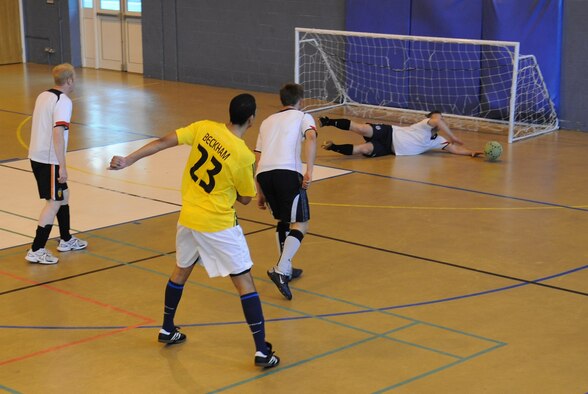 Barry 'the cat' King, saves yet another shot during the Intramural Soccer Championships at the Northside Fitness Center, May 27. King, certainly kept his team, the 100th Civil Engineer Squadron, in the game with a number of great saves in the second half as they came back from two goals down to defeat the 352nd Maintenance Squadron 3-2. (U.S. Air Force photo/ Staff Sgt. Jerry Fleshman)