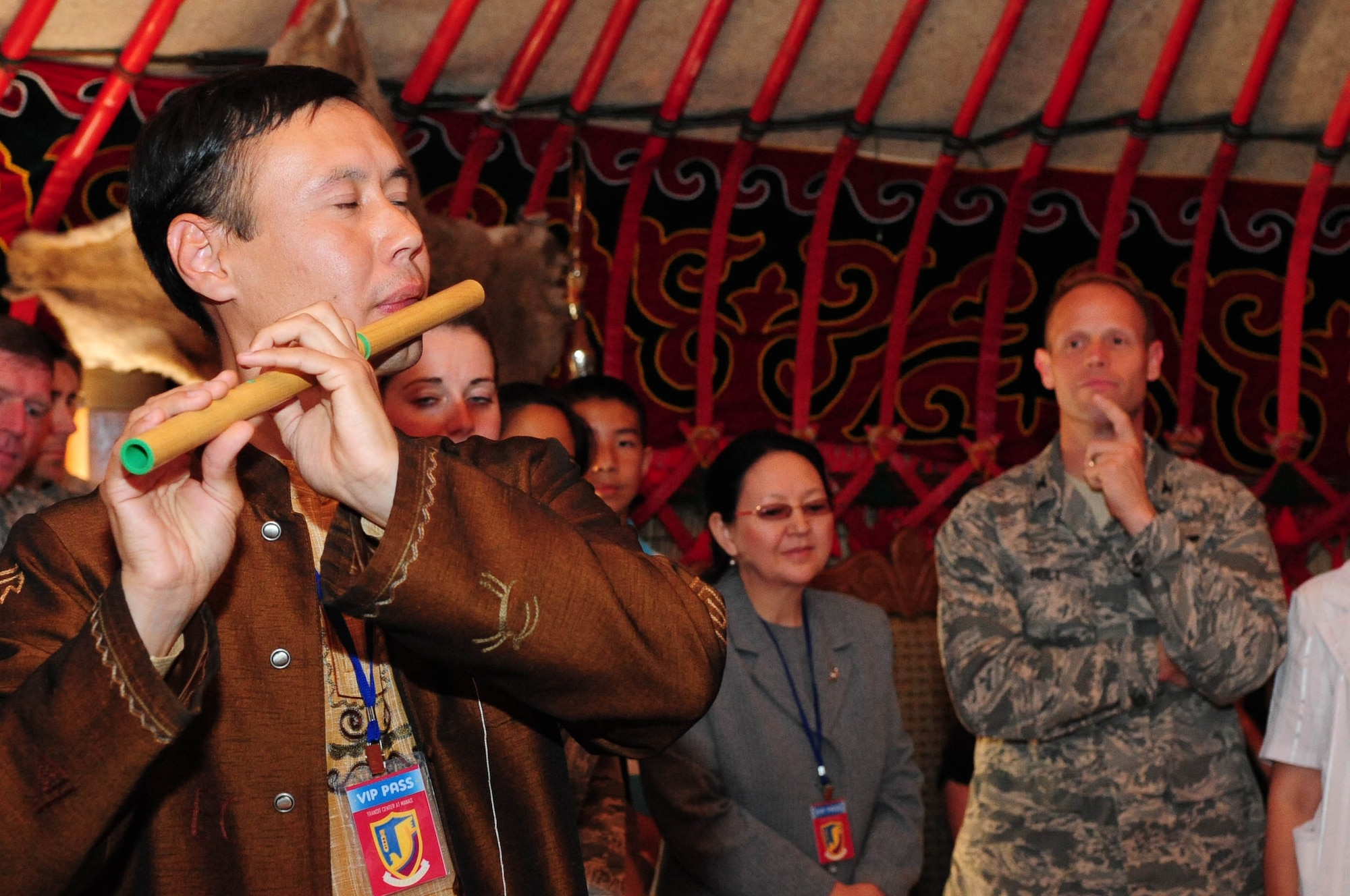 Asylbek Nasirdinov, a famous Kyrgyz musician, plays the traditional Kyrgyz woodwind instrument for Airmen, community leaders, and students during the grand opening of the newly-constructed Yurt at the Transit Center at Manas, Kyrgyzstan, May 28, 2010. Airmen embraced the "spirit of Kyrgyzstan" by celebrating the most recent building here: a Yurt, which is the traditional nomadic Kyrgyz home and a structure which now symbolizes friendship between the United States and its host nation here. (U.S. Air Force photo/ Senior Airman Nichelle Anderson/ released)