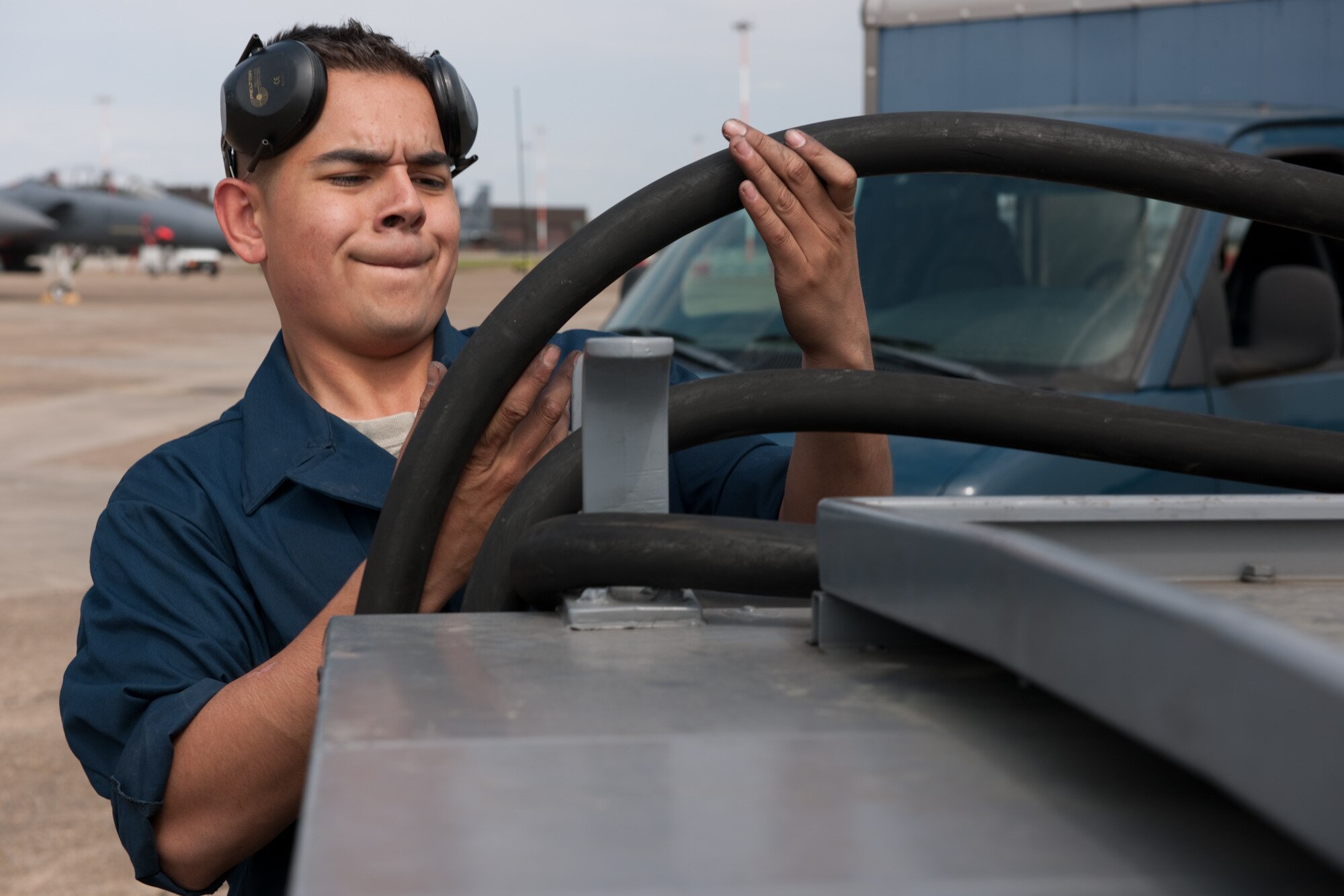 Airman 1st Class Raul Santos, 48th Aircraft Maintenance Squadron weapons team member, wraps up the power cable of a turbine generator after completing a 30 and 60 day inspection on an F-15 at RAF Mildenhall, England May 25. The maintenance squadron is working out of RAF Mildenhall temporarily while their home runway at RAF Lakenheath, England, is being repaired.  (U.S. Air Force photo/Tech. Sgt. Nathan Gallahan)