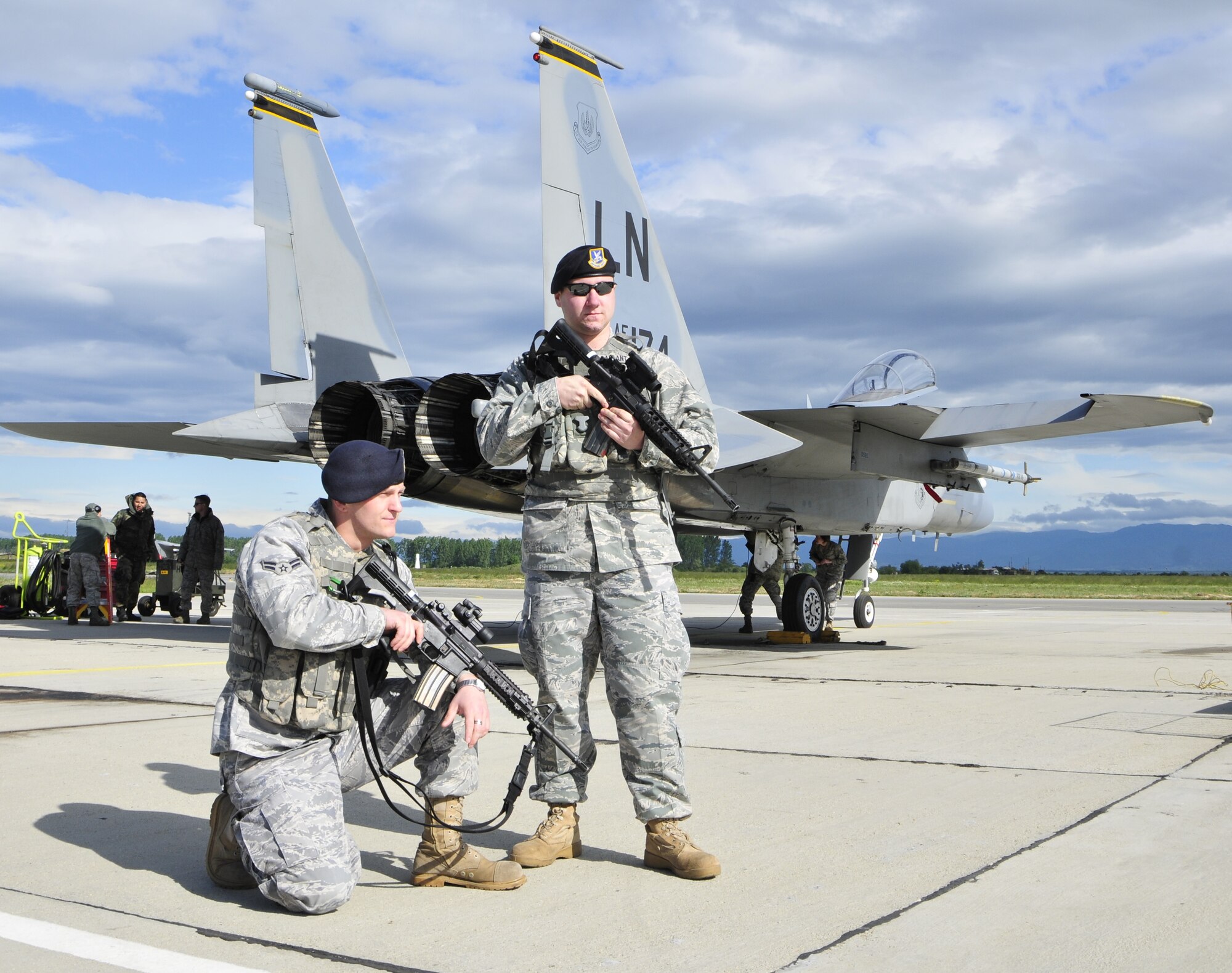 48th Security Forces Squadron patrolmen Senior Airman Sean Gallant and Airman 1st Class Thomas Brockman on the flightline at Graf Ignatievo Air Base, Bulgaria, May 18. The Airmen are here to ensure U.S. and Bulgarian air forces can continue to train and build partnerships with one another during joint-exercise Sentry Gold designed to assist the integration of the Bulgarian air force into NATO. (U.S. Air Force photo/Airman 1st Class Tiffany M. Deuel)