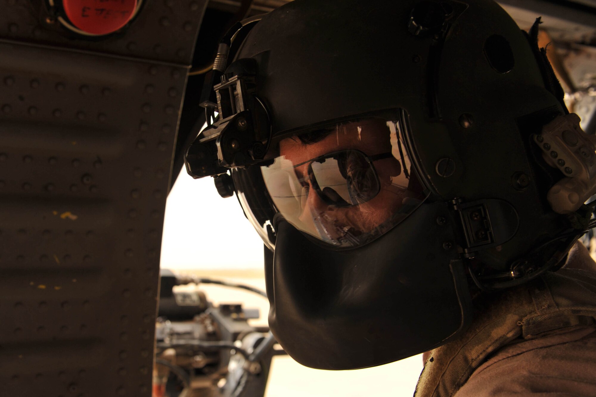 U.S. Air Force Senior Airman Joseph Arriza, an aerial gunner assigned to the 64th Expeditionary Rescue Squadron, checks the cargo compartment of an HH-60 Pave Hawk helicopter during a training flight May 15, 2010, near Joint Base Balad, Iraq.  (U.S. Air Force photo/Staff Sgt. Quinton Russ/released)