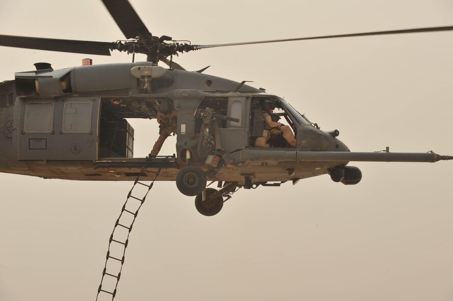 U.S. Air Force Staff Sgt. Dave Lamica throws a rope ladder during a training flight May 15, 2010. Sergeant Lamica is deployed to the 64th Expeditionary Rescue Squadron, Joint Base Balad, Iraq.  (U.S. Air Force photo/Staff Sgt. Quinton Russ/released)