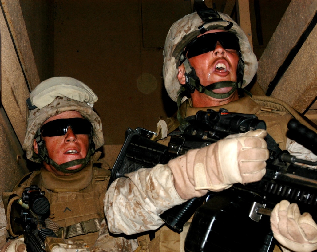 Lance Cpl. Sean Bill, and Pfc. River Welch, Company L, 3rd Battalion, 25th Marine Regiment advance upstairs to clear out role playing insurgents at K2 Combat Town, Camp Pendleton, Calif. May 28.  The Marines conducted a cordon and knock exercise in preparation for their upcoming deployment to Afghanistan later this year.