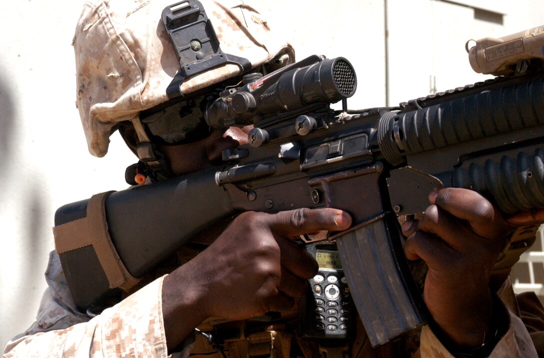 Cpl. Nenyi Nyen, a fire team leader with 1st Platoon, Company L, 3rd Battalion, 25th Marine Regiment posts security during a cordon and knock exercise at K2 Combat Town, Camp Pendleton, Calif. May 28.  The Marines conducted a cordon and knock exercise in preparation for their upcoming deployment to Afghanistan later this year.