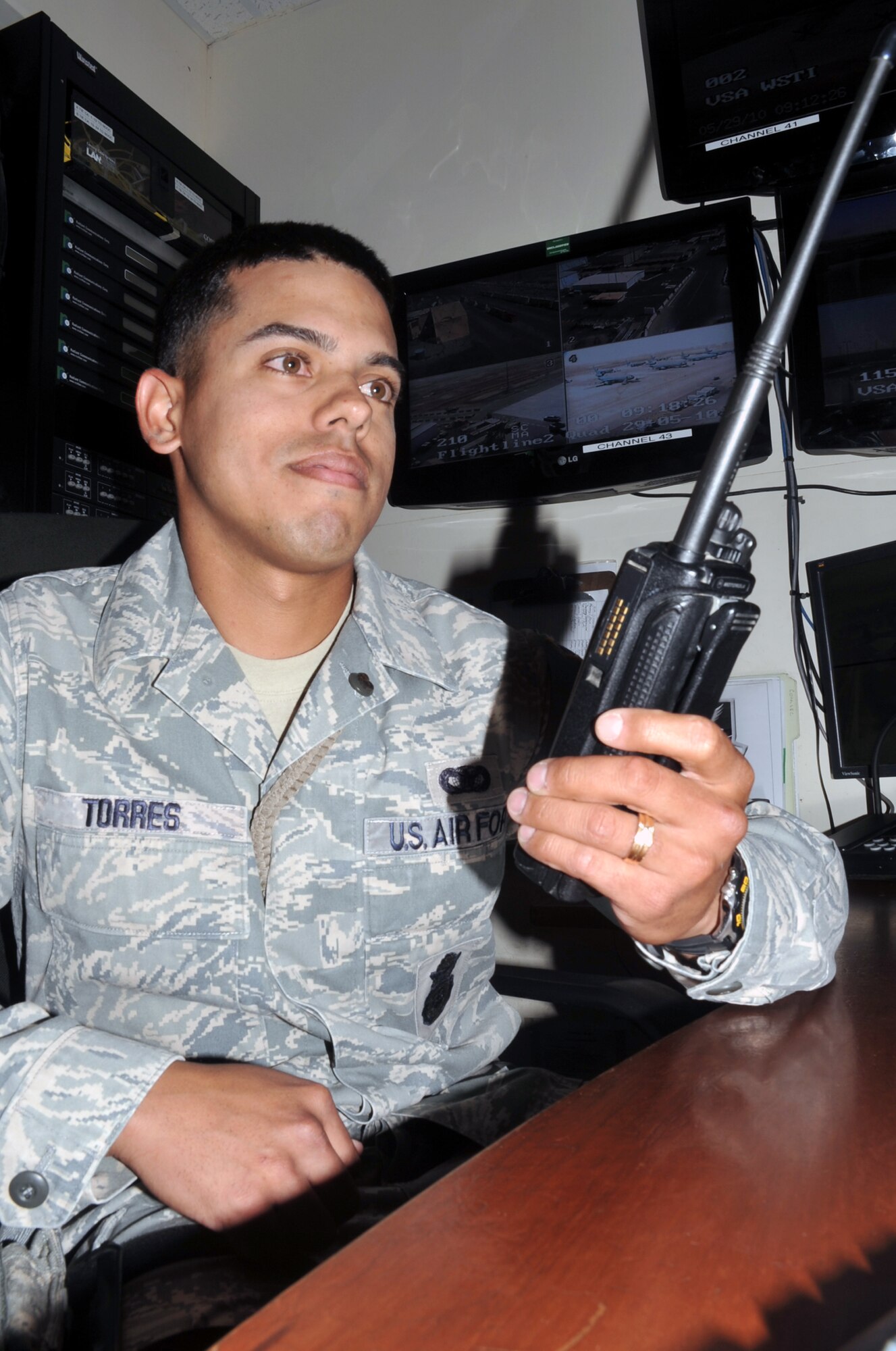 Senior Airman Luis Torres, a security forces journeyman with the 380th Expeditionary Security Forces Squadron, works in the security forces operations area at a non-disclosed base in Southwest Asia. Airman Torres is deployed from the 96th Security Forces Squadron at Eglin Air Force Base, Fla., and his hometown is Villalba, Puerto Rico. (U.S. Air Force Photo/Master Sgt. Scott T. Sturkol/Released)