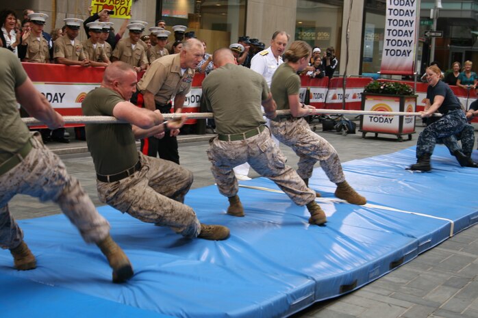 NEW YORK -- Lieutenant General Dennis J Hejlik, commander of 2nd Marine Expeditionary Force based in Camp Lejeune, N.C., cheers on Marines from Special Purpose Air Ground Task Force New York. The Marines competed against a team of sailors in a tug-of-war contest during a segment for NBC's Today Show, May 29 2010. More than 3,000 Marines, Sailors and Coast Guardsmen will be in the area participating in community outreach events and equipment demonstrations. This is the 26th year New York City has hosted the sea services for Fleet Week.