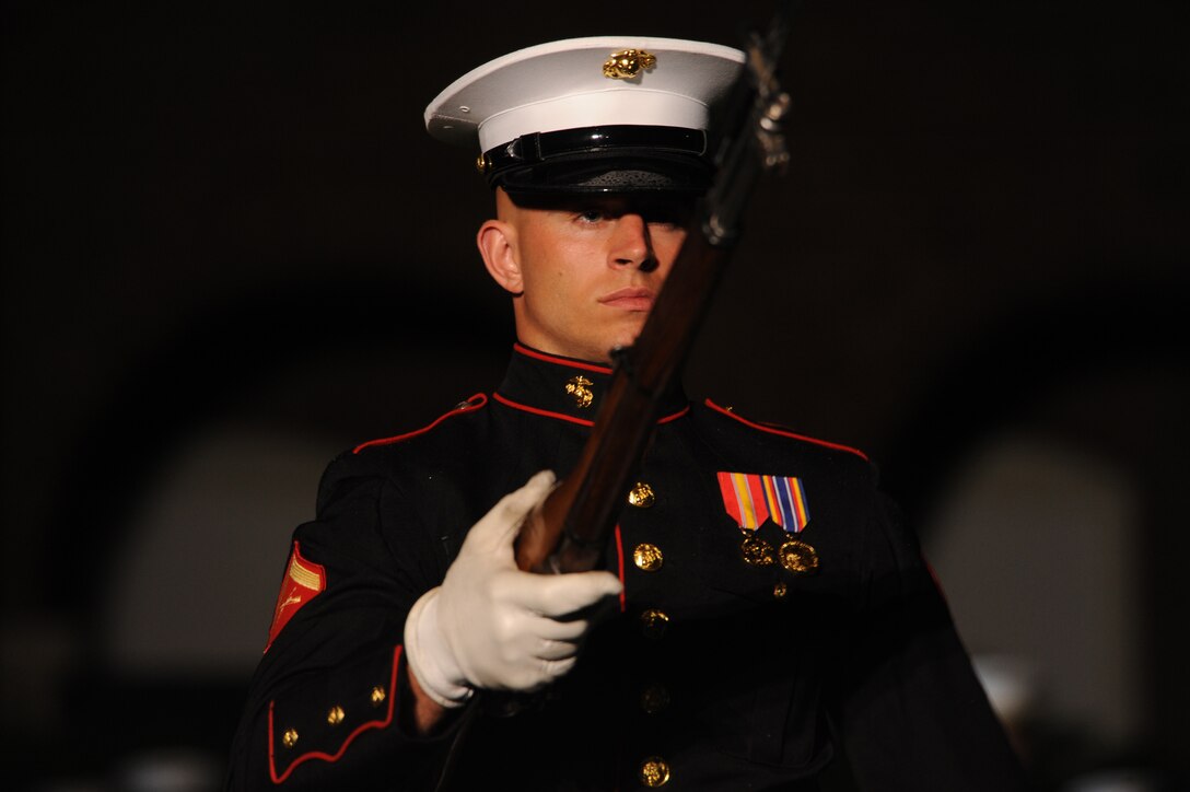 Lance Cpl. John Nelson, a member of the United States Marine Silent Drill Platoon, performs during the Friday Evening Parade May 28.  (Photo by Cpl. Joseph A. Cabrera)