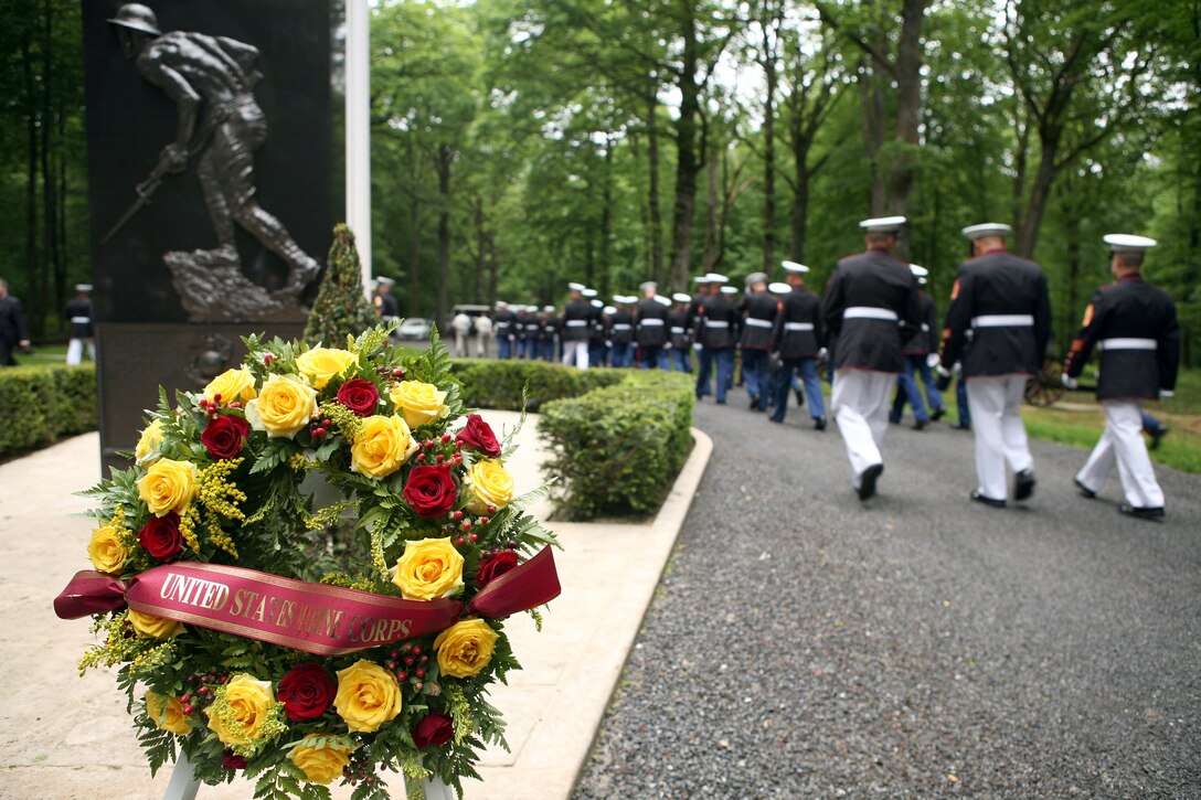 Marines depart the Iron Mike memorial area in the heart of Belleau Wood after a wreath laying ceremony in honor of the more than 1,800 Marines who died in the World War I Battle for Belleau Wood.